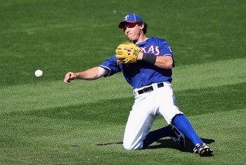 SURPRISE, AZ - MARCH 02: Infielder Ian Kinsler #5 of the Texas Rangers fields a ground ball out against the Los Angeles Angels of Anaheim during the spring training game at Surprise Stadium on March 2, 2011 in Surprise, Arizona. (Photo by Christian Pete SURPRISE, AZ - MARCH 02: Infielder Ian Kinsler #5 of the Texas Rangers fields a ground ball out against the Los Angeles Angels of Anaheim during the spring training game at Surprise Stadium on March 2, 2011 in Surprise, Arizona. (Photo by Christian Pete