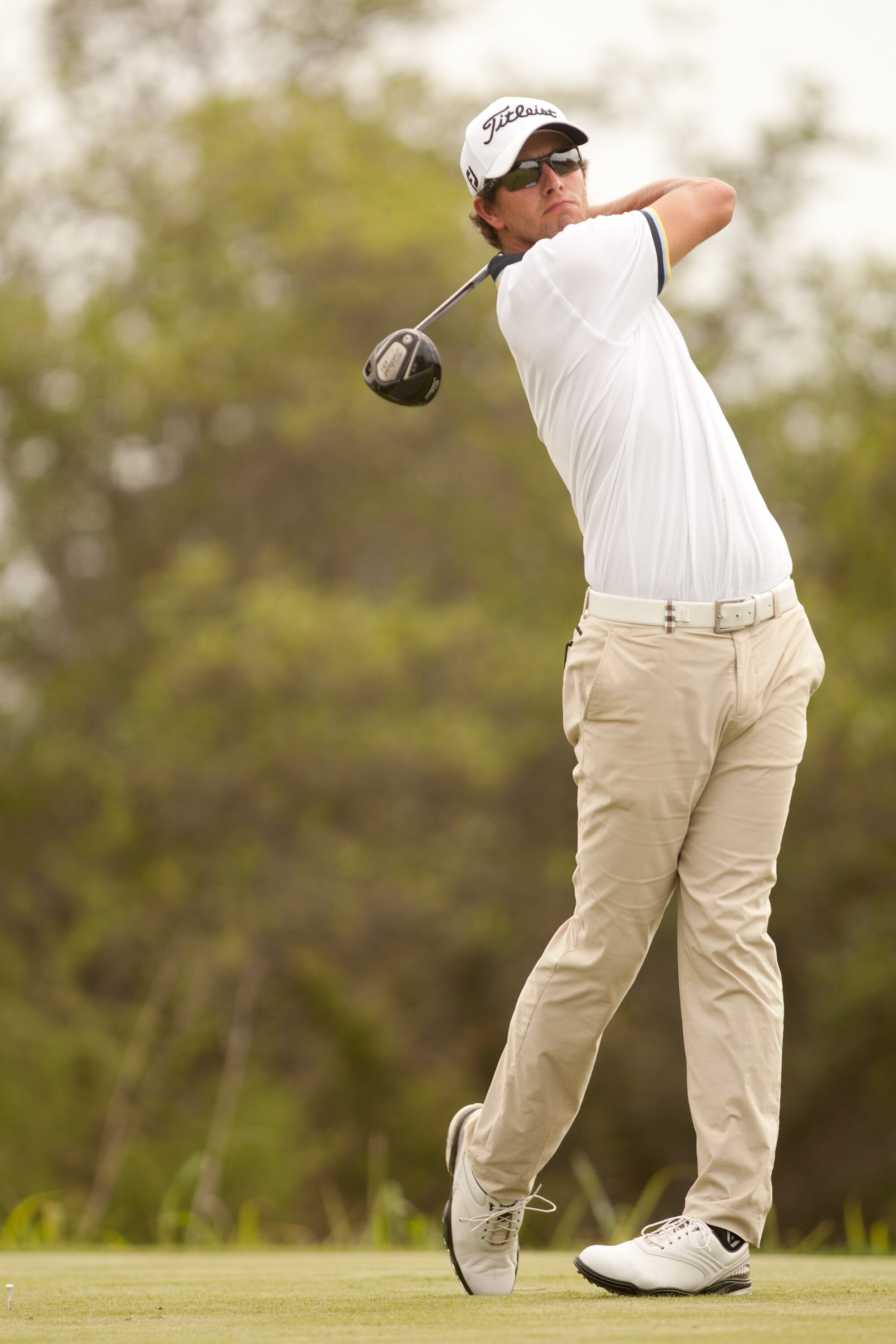 SAN ANTONIO, TX - APRIL 17: Adam Scott of Australia follows through on a tee shot during the final round of the Valero Texas Open at the AT&T Oaks Course at TPC San Antonio on April 17, 2011 in San Antonio, Texas. (Photo by Darren Carroll/Getty Images)
