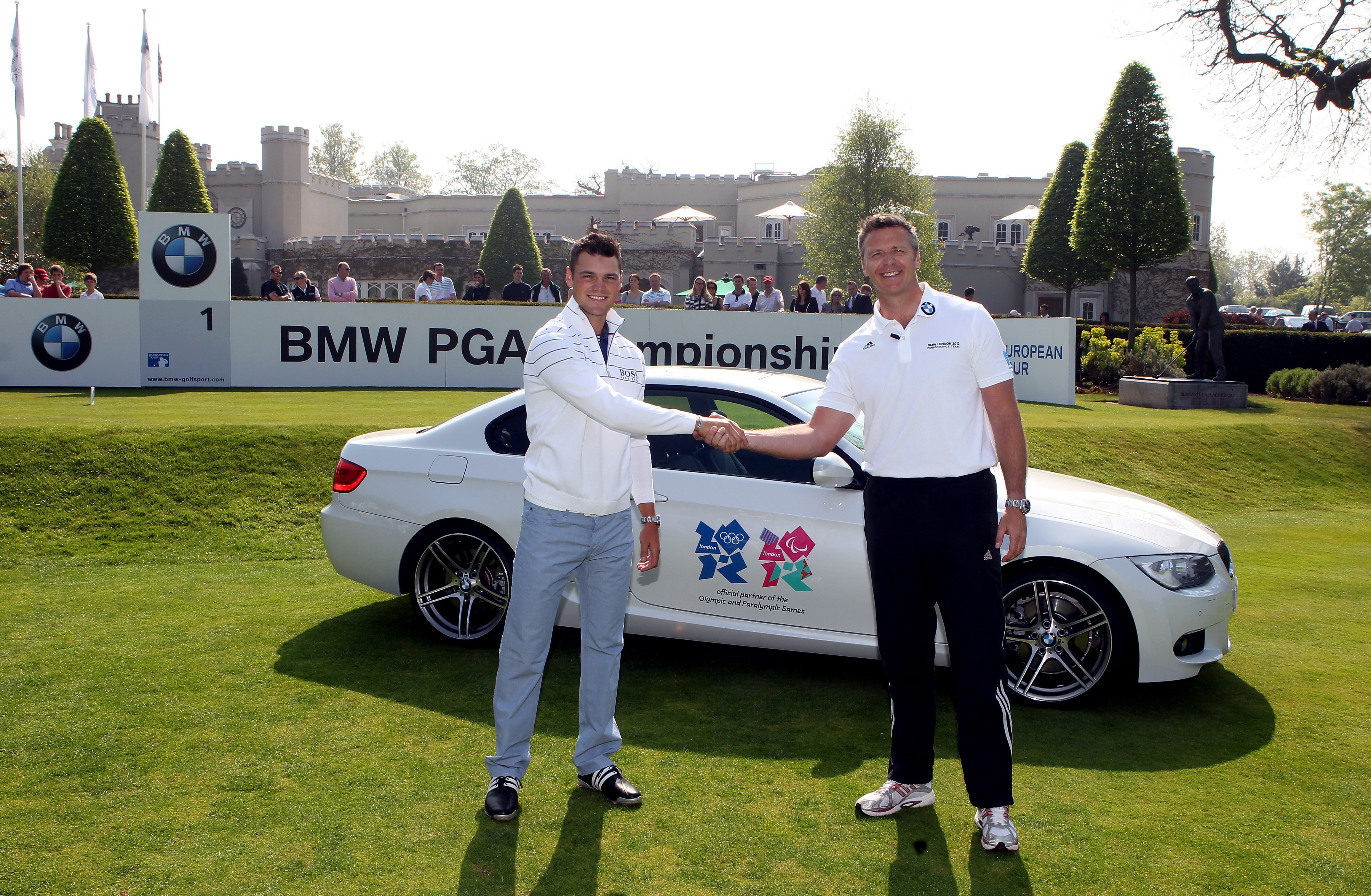 VIRGINIA WATER, ENGLAND - APRIL 20:  (L-R)  World number one golfer Martin Kaymer of Germany and Former Olympic medallist Steve Backley pose for a photograph during a challenge at the BMW PGA Championship Media Day at Wentworth Club on April 20, 2011 in V