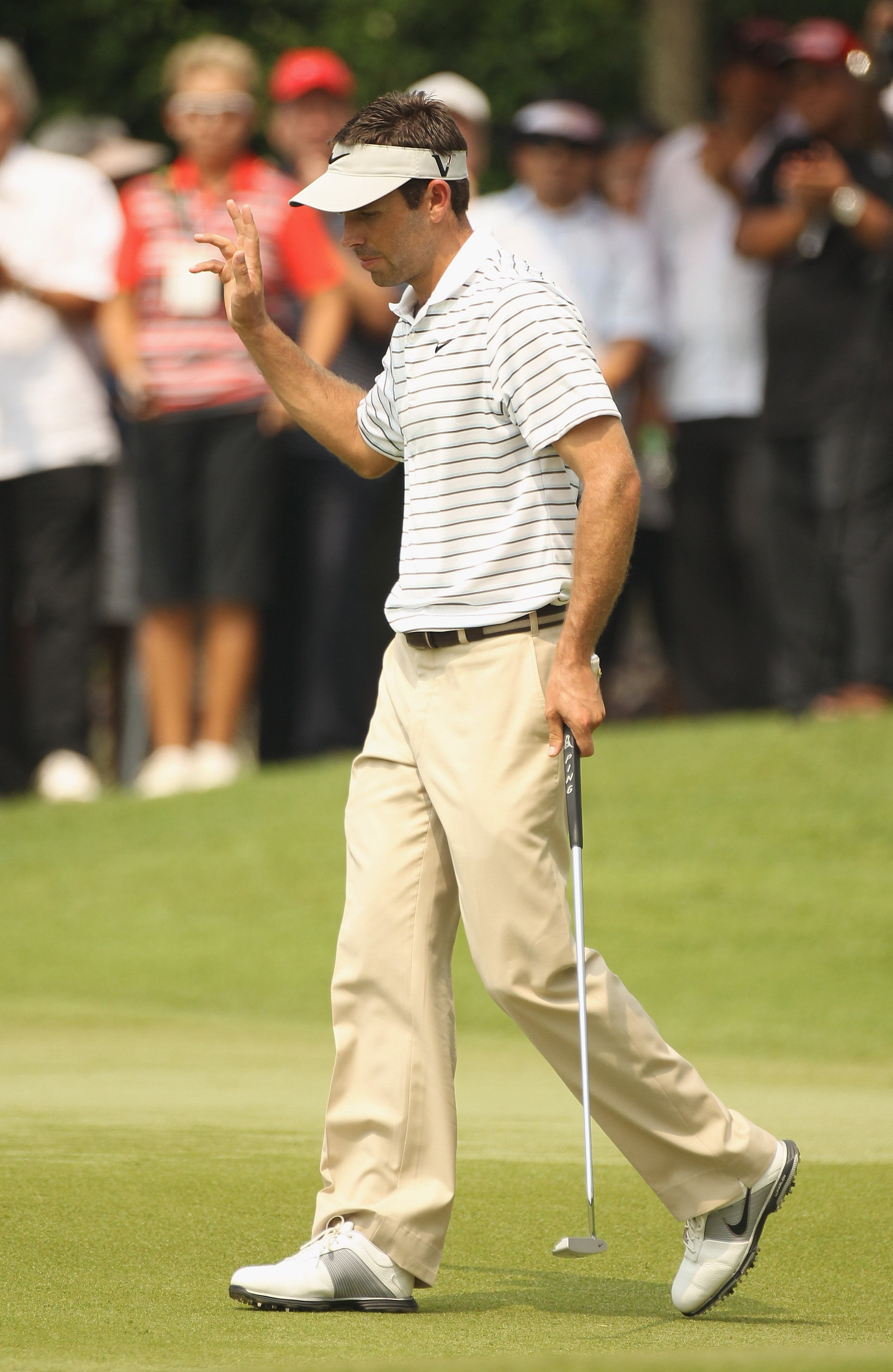 KUALA LUMPUR, MALAYSIA - APRIL 15:  Charl Schwartzel of South Africa celebrates on the 9th green during the second round of the Maybank Malaysian Open at Kuala Lumpur Golf & Country Club on April 15, 2011 in Kuala Lumpur, Malaysia.  (Photo by Ian Walton/G