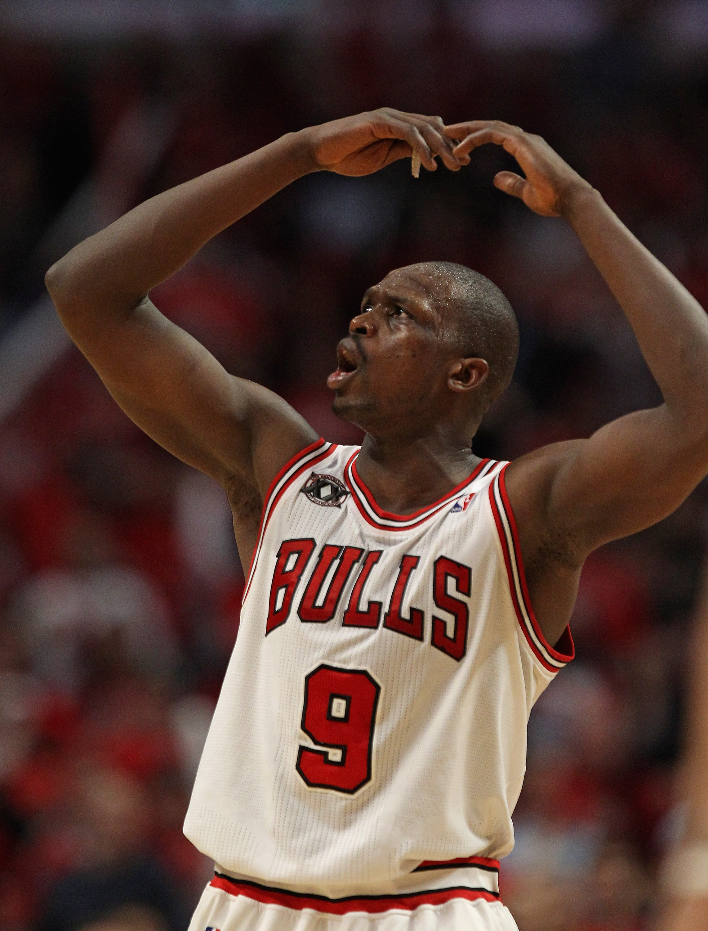 CHICAGO, IL - APRIL 16: Loul Deng #9 of the Chicago Bulls encourages the crowd to cheer in the 4th quarter against the Indiana Pacers in Game One of the Eastern Conference Quarterfinals in the 2011 NBA Playoffs at the United Center on April 16, 2011 in Ch