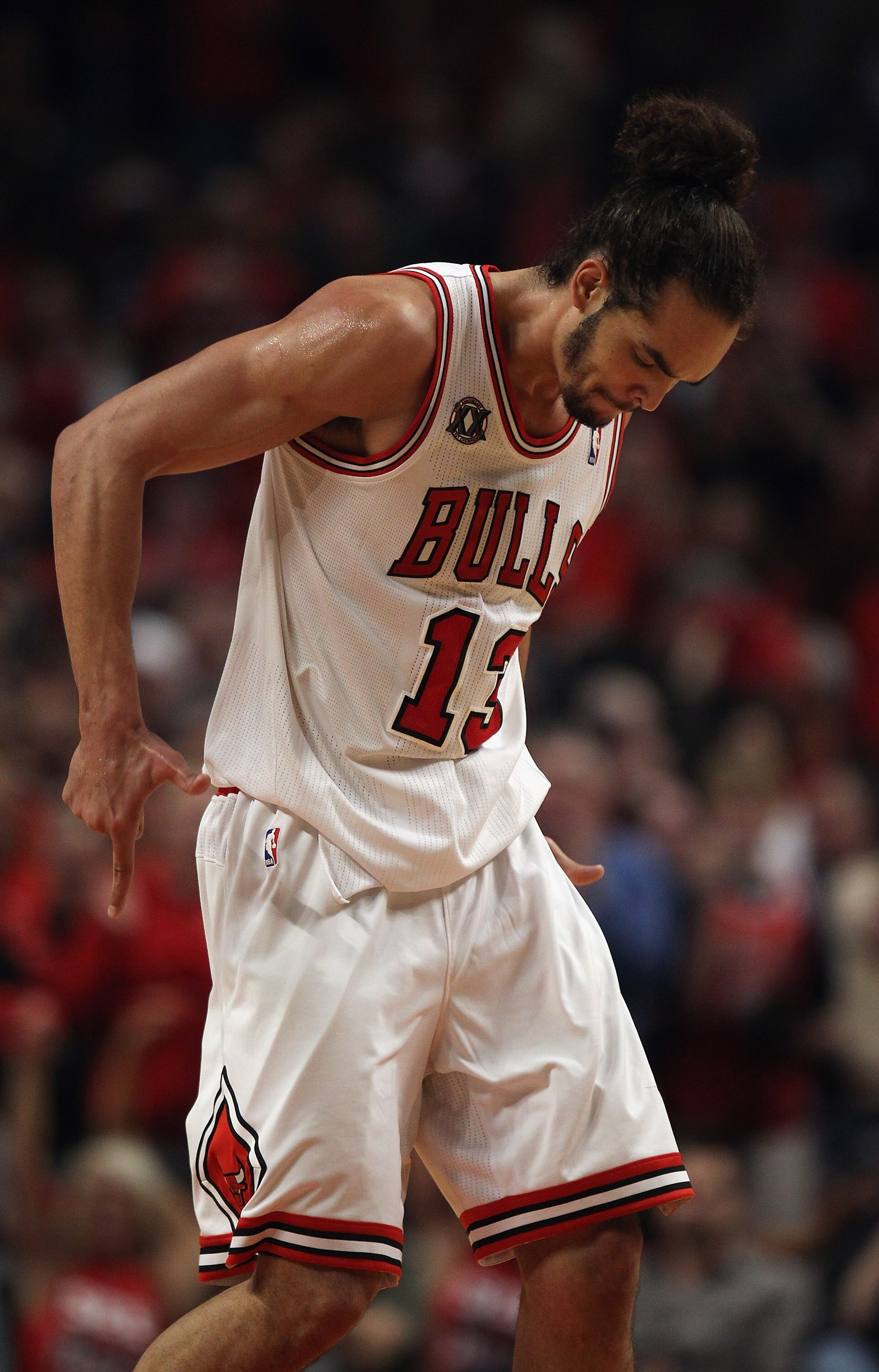 CHICAGO, IL - APRIL 16: Joakim Noah #13 of the Chicago Bulls celebrates a win over the Indiana Pacers in Game One of the Eastern Conference Quarterfinals in the 2011 NBA Playoffs at the United Center on April 16, 2011 in Chicago, Illinois. The Bulls defea