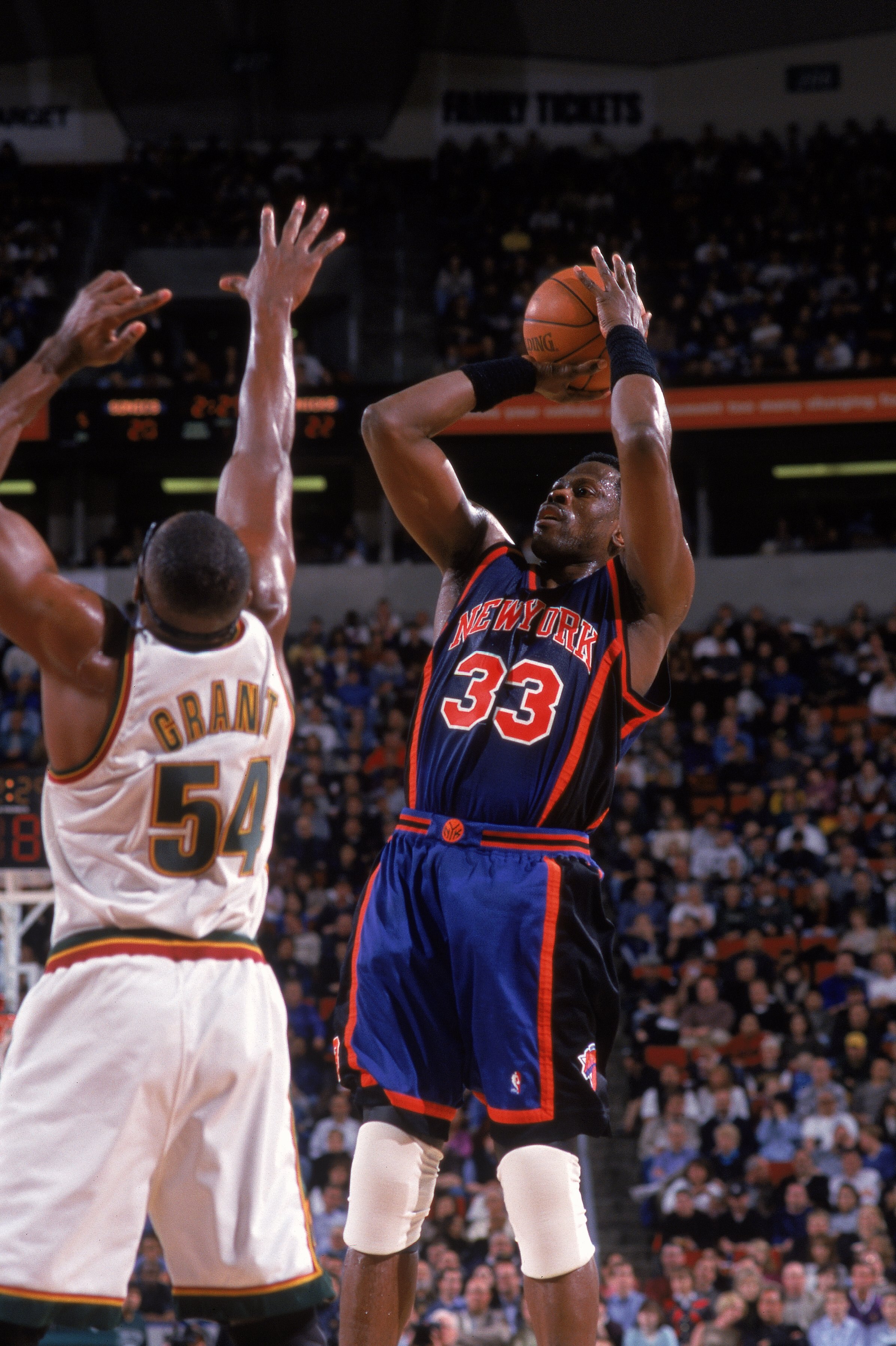 29 Mar 2000: Patrick Ewing #33 of the New York Knicks takes a shot as he is guarded by Horace Grant #54 of the Seattle SuperSonics at Key Arena in Seattle, Washington. The Knicks defeated the SuperSonics 110-95.   Mandatory Credit: Otto Greule Jr.  /Allsp