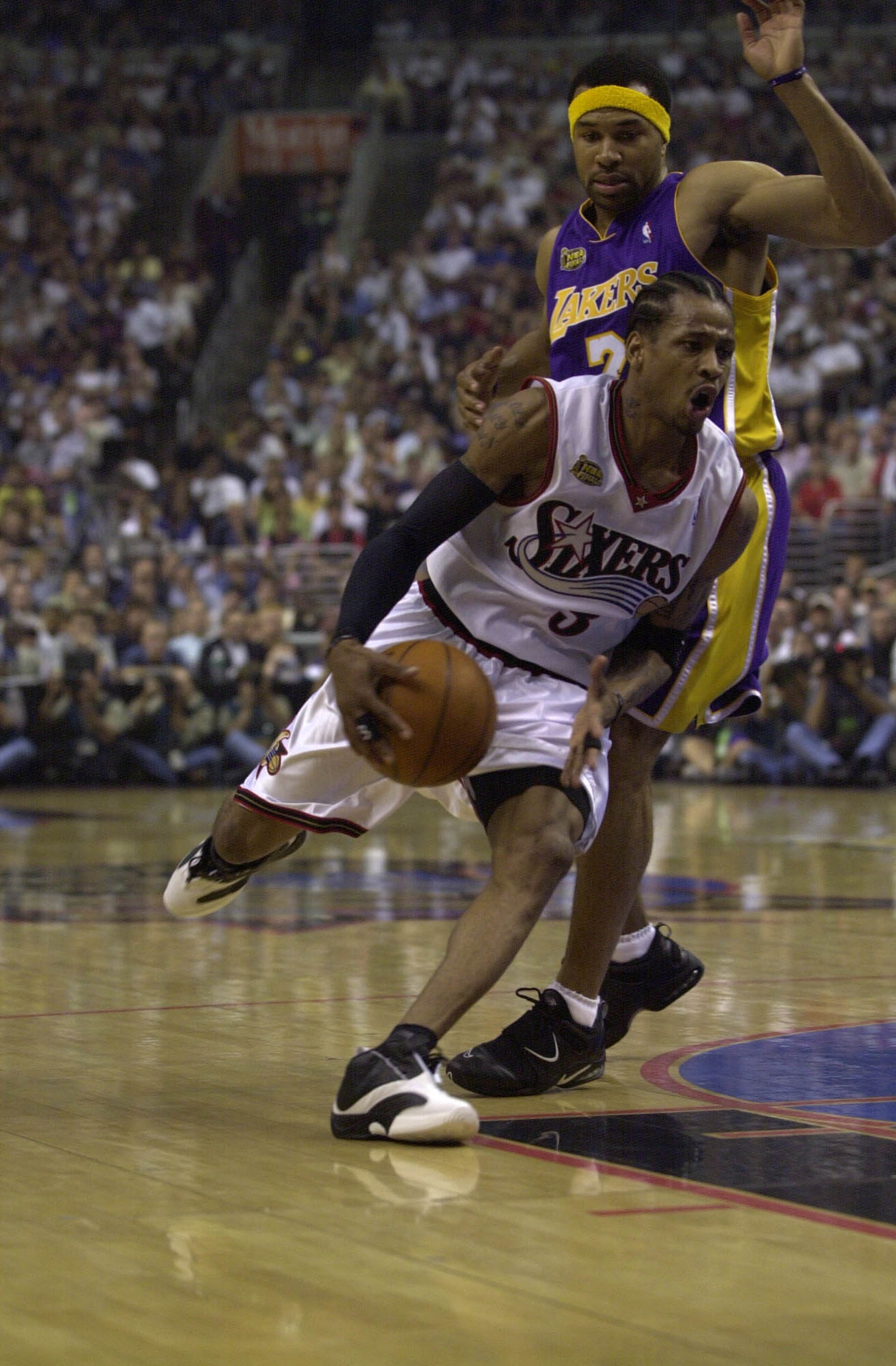 15 Jun 2001:  Allen Iverson #3 of the Philadelphia 76ers drives past Derek Fisher #2 of the Los Angeles Lakers in game five of the NBA Finals at the First Union Center in Philadelphia, Pennsylvania.  The Lakers won 108-86 to take the series 4-1 and the NB