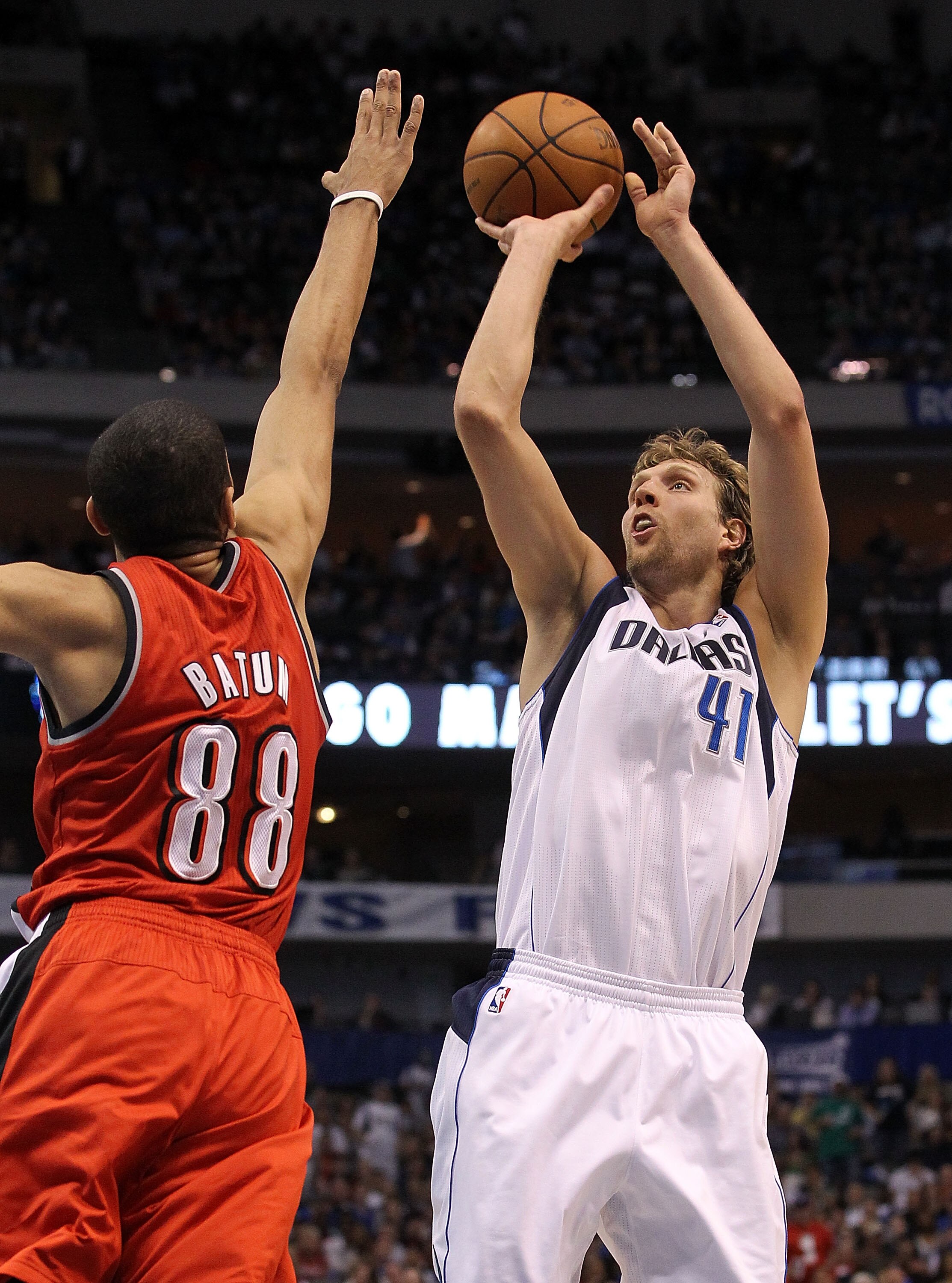 DALLAS, TX - APRIL 16:  Forward Dirk Nowitzki #41 of the Dallas Mavericks takes a shot against Nicolas Batum #88 of the Portland Trail Blazers in Game One of the Western Conference Quarterfinals during the 2011 NBA Playoffs on April 16, 2011 at American A