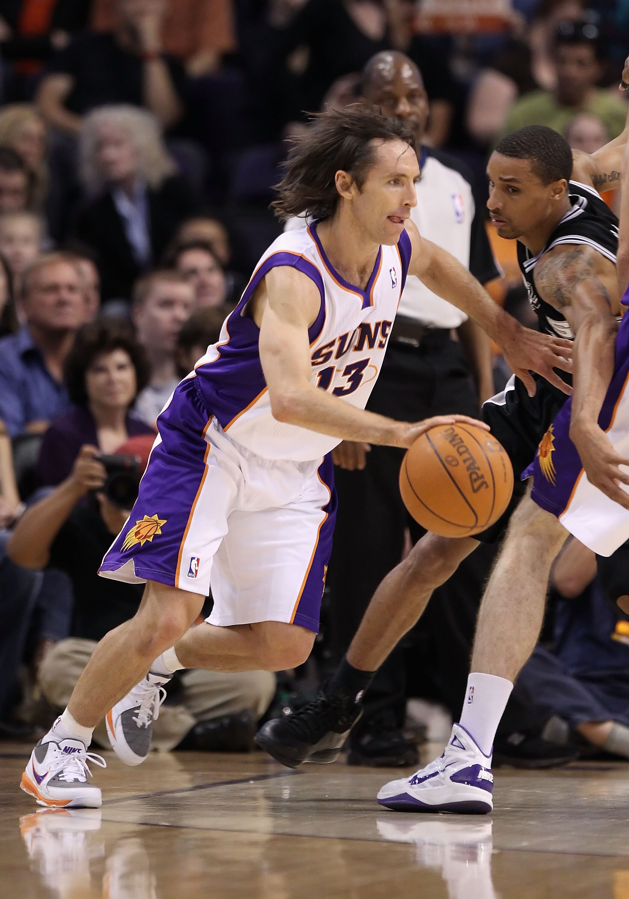 PHOENIX, AZ - APRIL 13:  Steve Nash #13 of the Phoenix Suns drives the ball during the NBA game against the San Antonio Spurs at US Airways Center on April 13, 2011 in Phoenix, Arizona.  NOTE TO USER: User expressly acknowledges and agrees that, by downlo