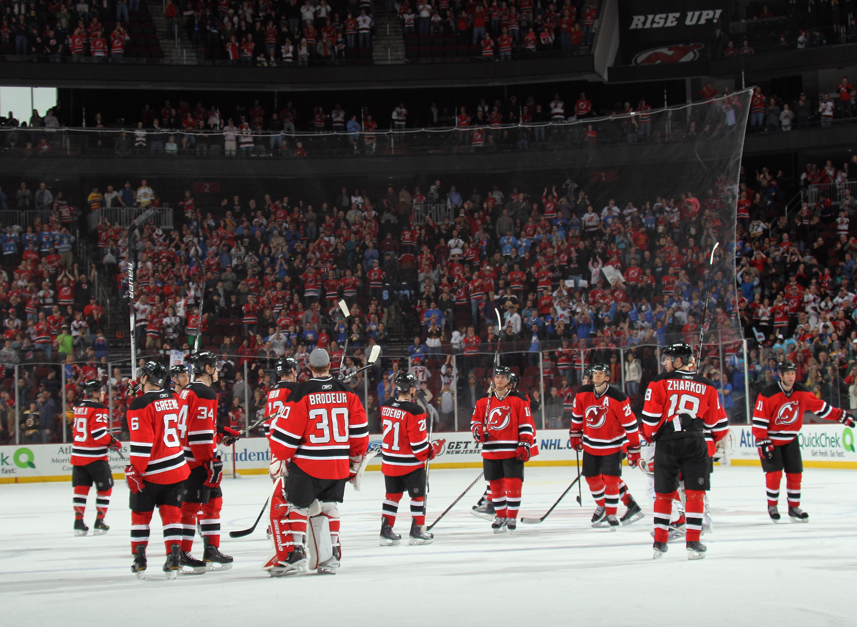 NEWARK, NJ - APRIL 10: The New Jersey Devils salute their fans following their last game of the season against the Boston Bruins at the Prudential Center on April 10, 2011 in Newark, New Jersey.  (Photo by Bruce Bennett/Getty Images)
