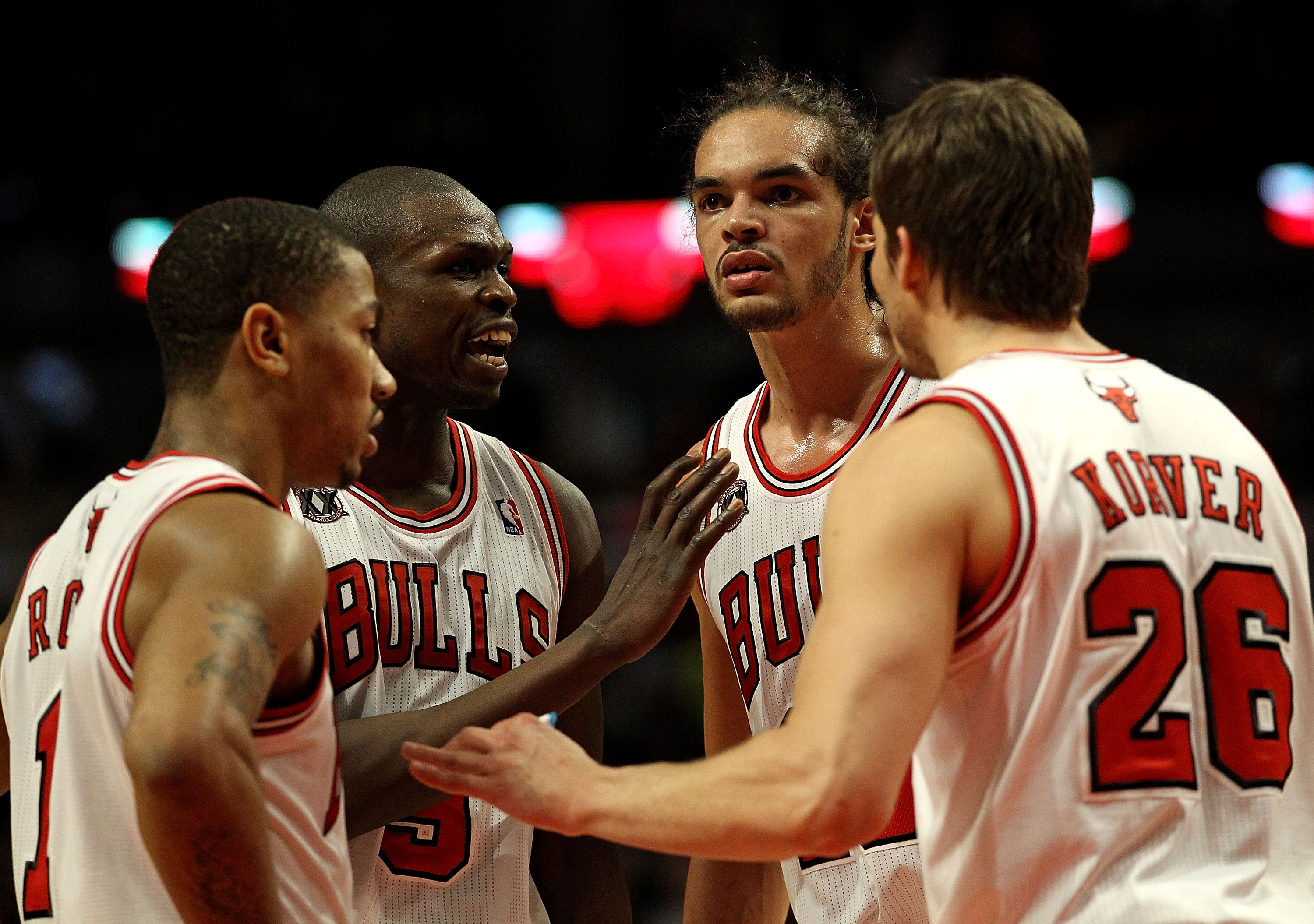 CHICAGO, IL - MARCH 25: (L-R) Derrick Rose #1, Loul Deng #9, Joakim Noah #13 and Kyle Korver #26 of the Chicago Bulls gather to talk during a game against the Memphis Grizzlies at the United Center on March 25, 2011 in Chicago, Illinois. The Bulls defeate
