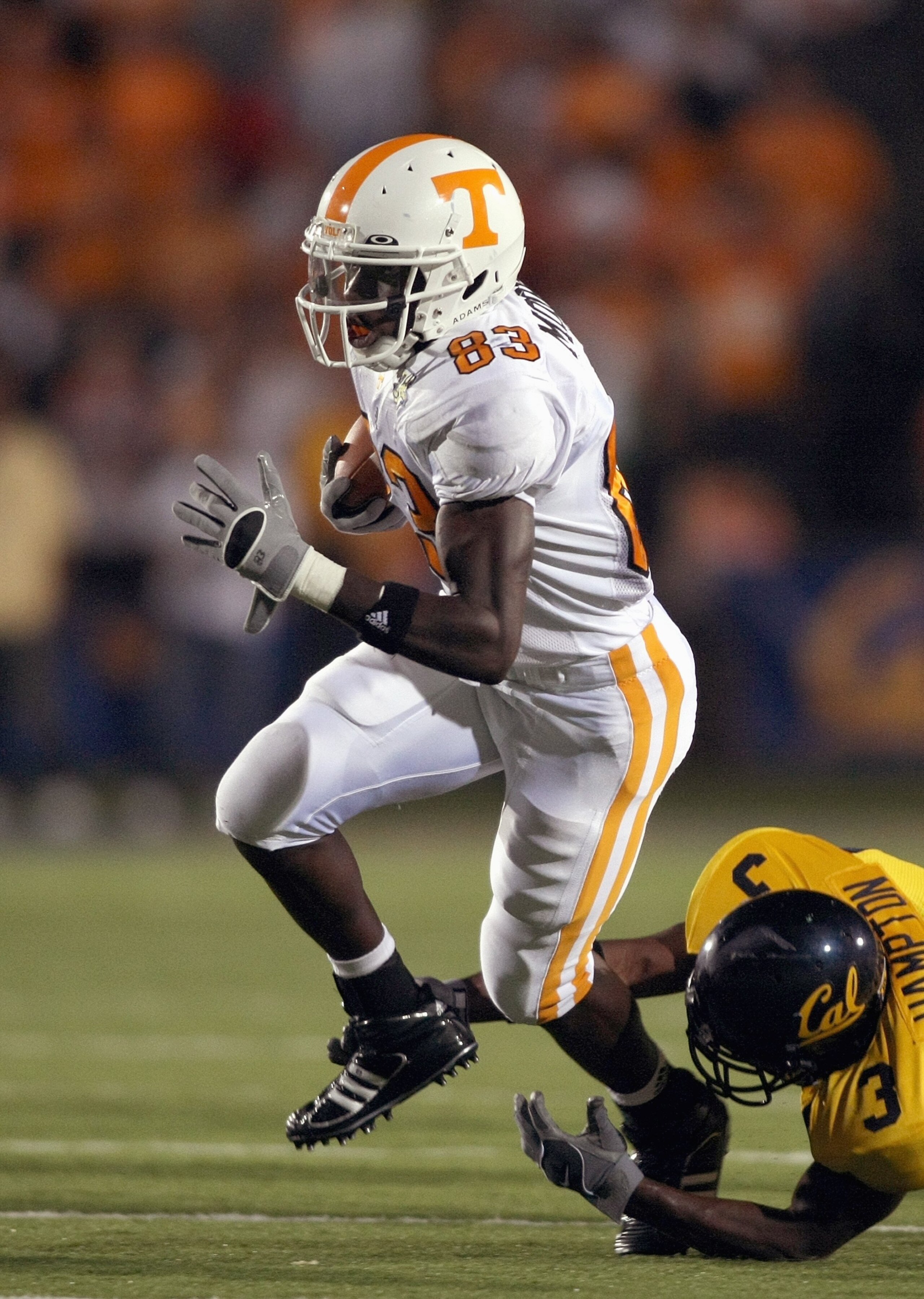 BERKELEY, CA - SEPTEMBER 01: Denarius Moore #83 of the Tennessee Volunteers carries the ball as he evades Brandon Hampton #3 of the California Golden Bears at Memorial Stadium on September 1, 2007 in Berkeley, California. (Photo by Jonathan Ferrey/Getty I