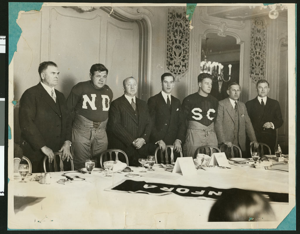 1927 dinner with the players before the game; standing left to right: Glenn Pop Warner, Babe Ruth, Knute Rockne, Christy Walsh, Lou Gehrig, Howard Jones, Tad Joneses