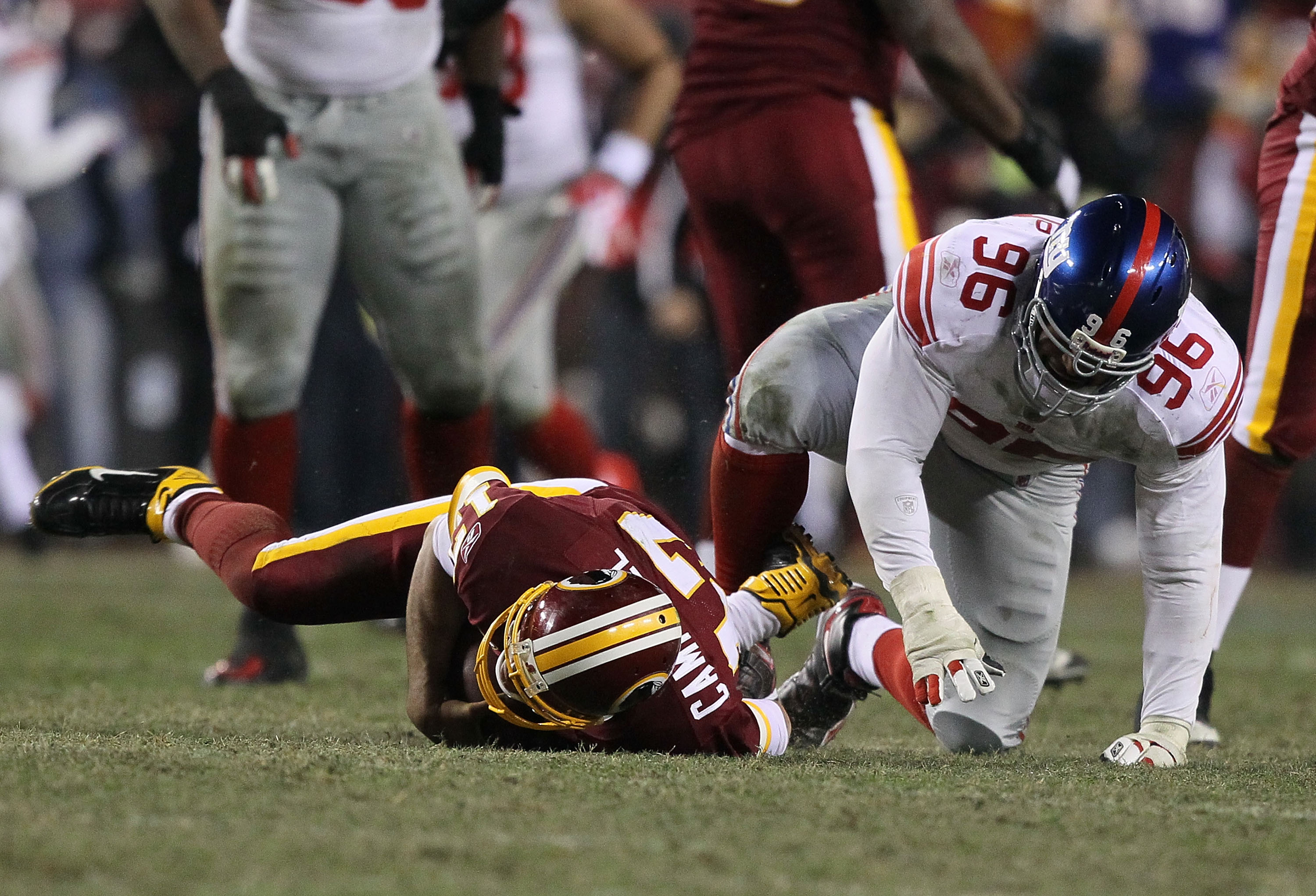 LANDOVER, MD - DECEMBER 21:  Jason Cambell #17 of the Washington Redskins is sacked by Barry Cofield #96 of the New York Giants during their game on December 21, 2009 at Fedex Field in Landover, Maryland.  (Photo by Al Bello/Getty Images)