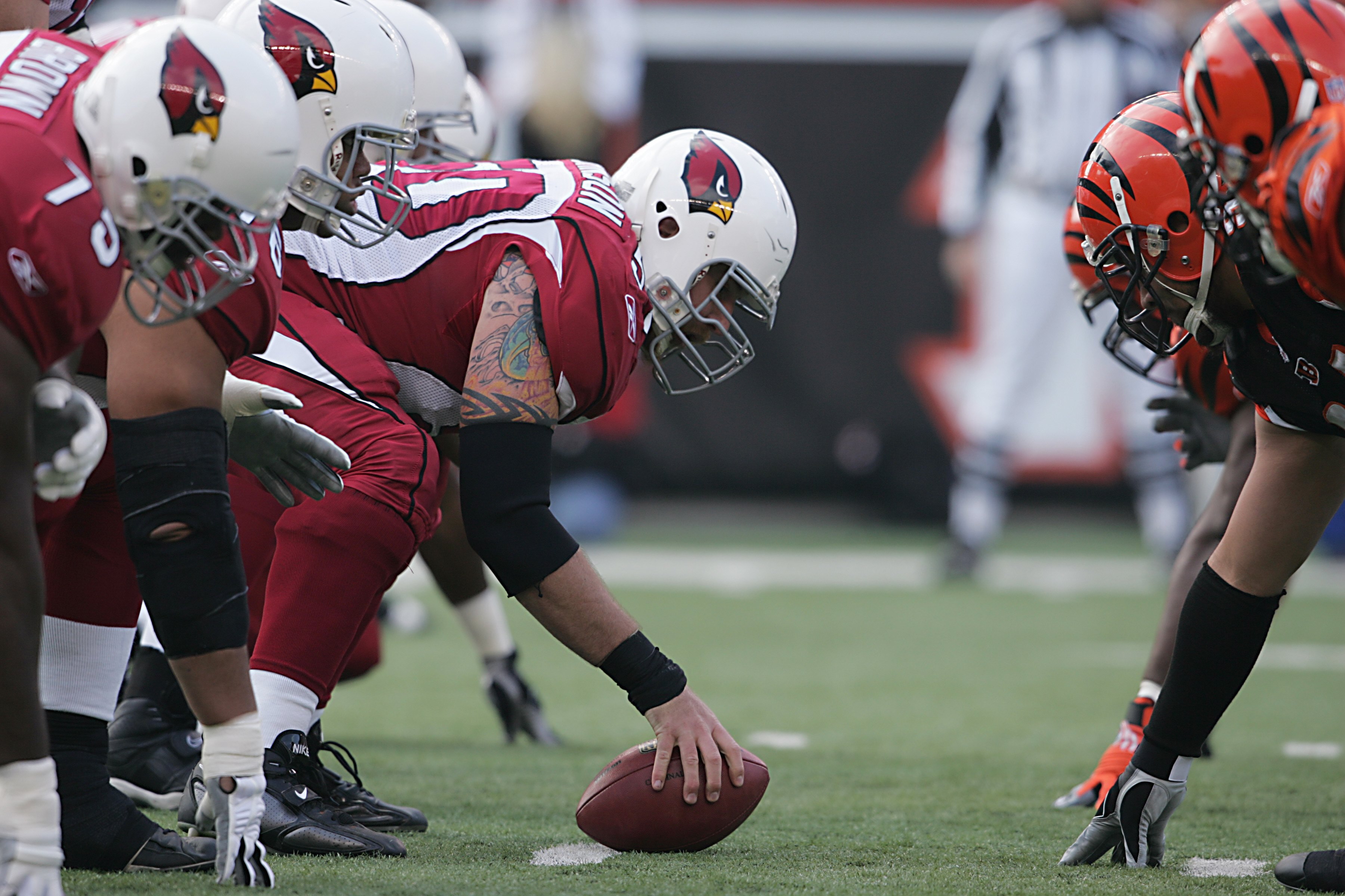 CINCINNATI - NOVEMBER 18:  Al Johnson #50 of the Arizona Cardinals crouches into position at the line of scrimmage during the NFL game against the Cincinnati Bengals at Paul Brown Stadium on November 18, 2007 in Cincinnati, Ohio. (Photo by Andy Lyons/Gett