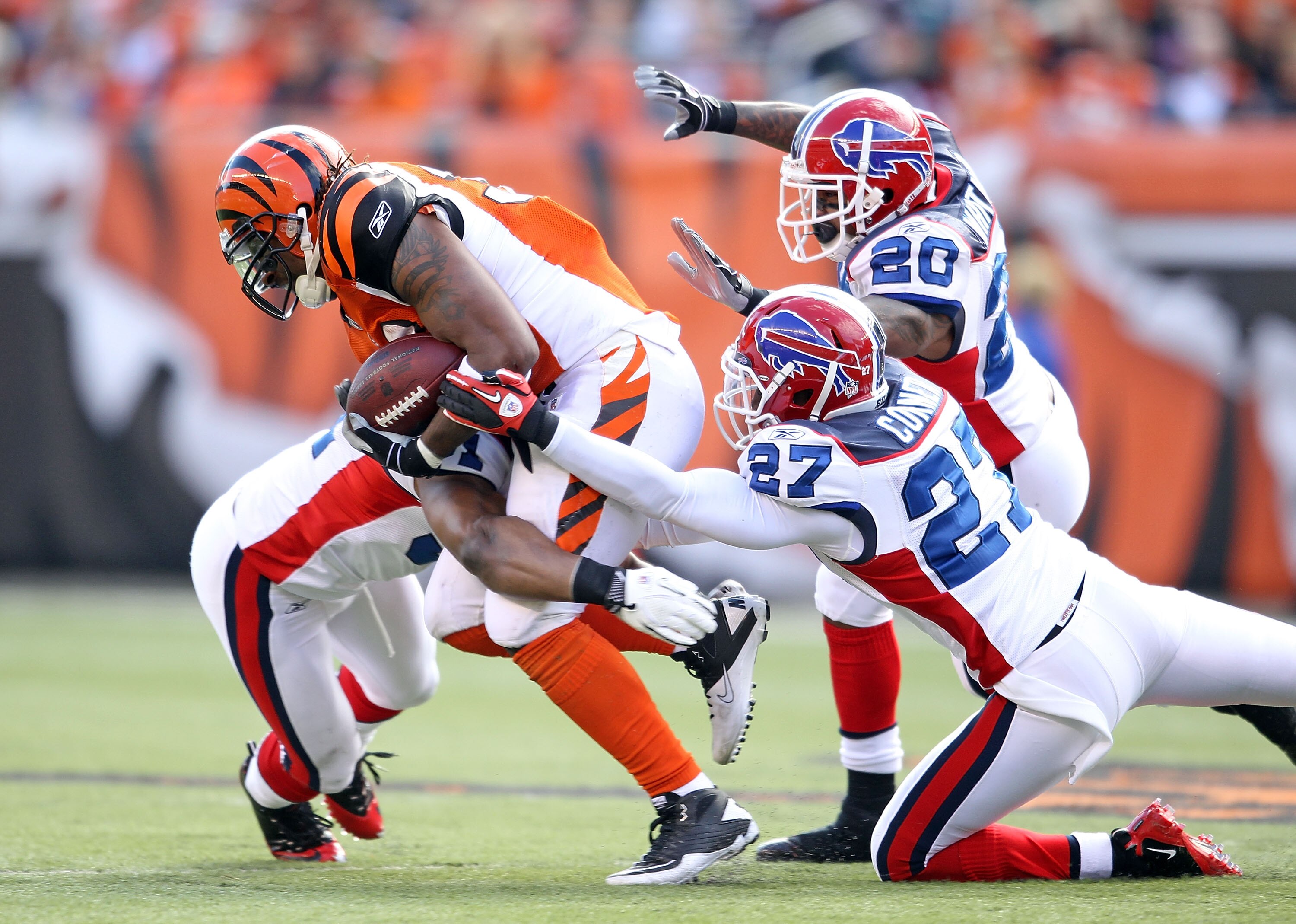 CINCINNATI - NOVEMBER 21:  Cedric Benson #32 of the Cincinnati Bengals is tackled by Jarius Byrd #31, Reggie Corner #27  and Donte Whitner #20 of the Buffalo Bills during the NFL game at Paul Brown Stadium on November 21, 2010 in Cincinnati, Ohio.  (Photo