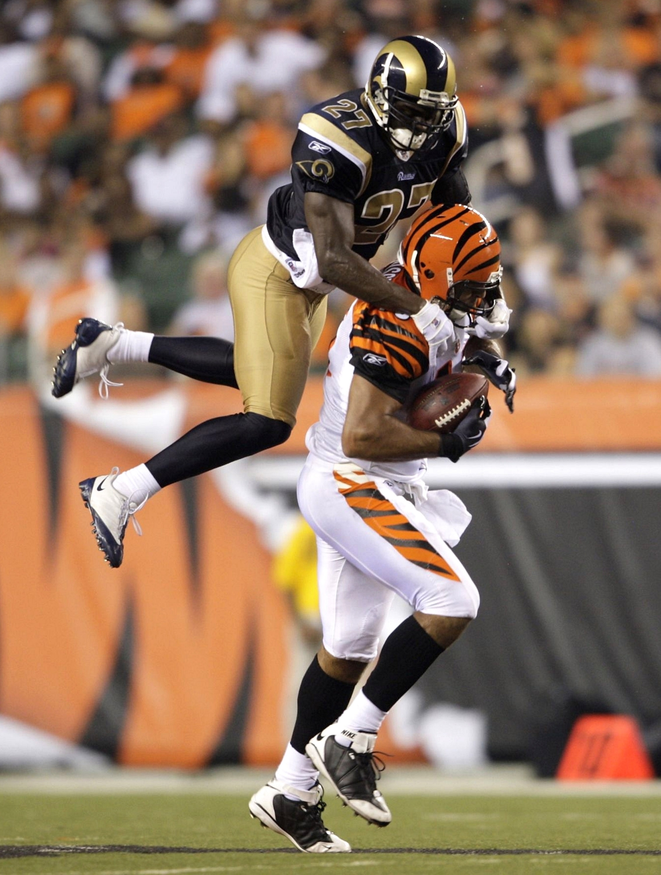CINCINNATI, OH - AUGUST 27:  Tight end J. P. Foschi #45 of the Cincinnati Bengals runs after the catch against David Roach #27 of the St. Louis Rams during the preseason game at Paul Brown Stadium on August 27, 2009 in Cincinnati, Ohio. (Photo by Andy Lyo