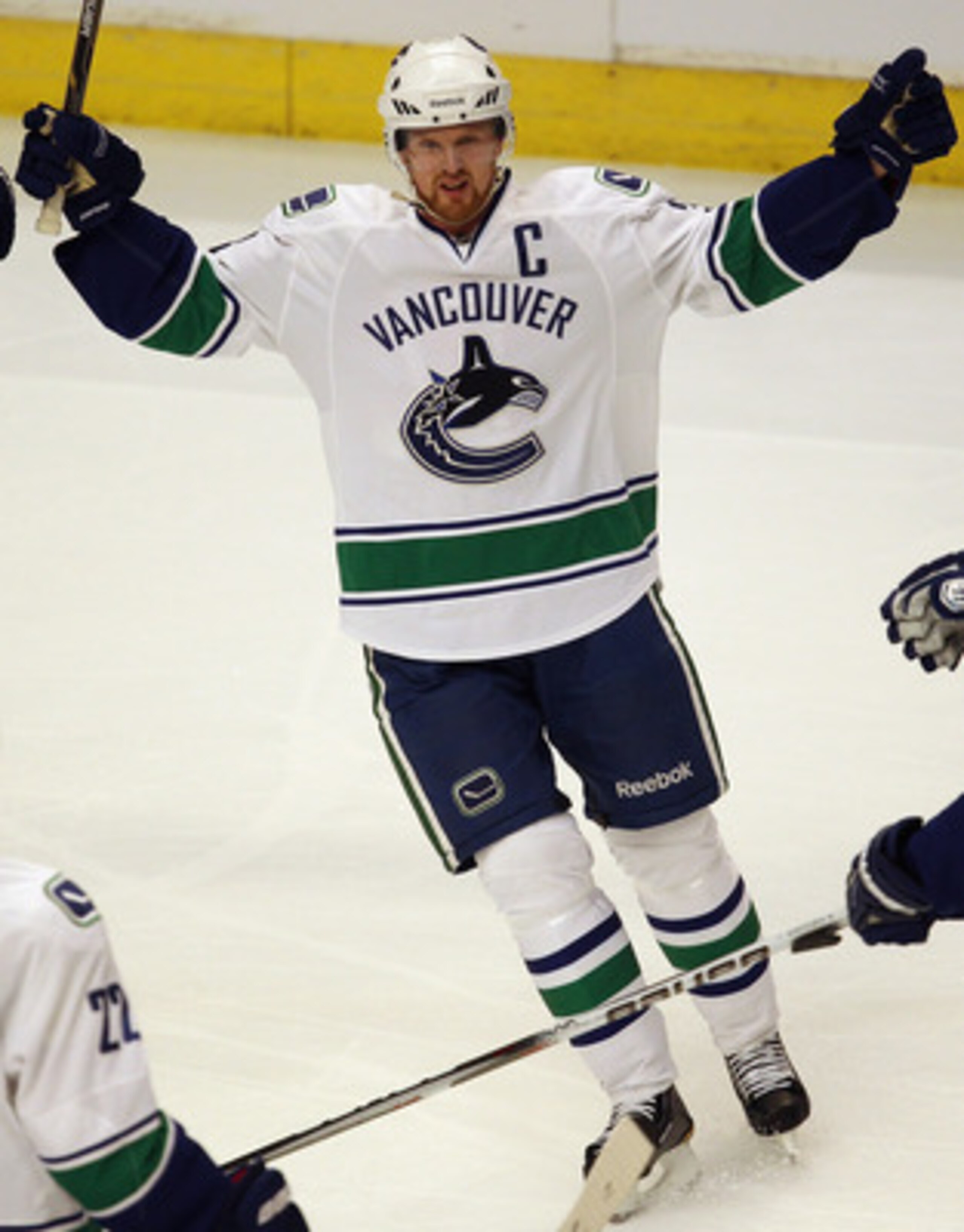 CHICAGO, IL - APRIL 17: Henrik Sedin #33 of the Vancouver Canucks celebrates a teammates' goal against the Chicago Blackhawks in Game Three of the Western Conference Quarterfinals during the 2011 NHL Stanley Cup Playoffs at the United Center on April 17,