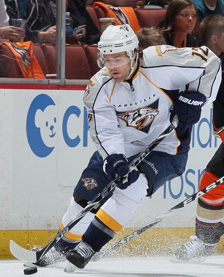 ANAHEIM, CA - APRIL 15:  Mike Fisher #12 of the Nashville Predators is pursued by Teemu Selanne # 8 of the Anaheim Ducks for the puck in the first period of Game Two of the Western Conference Quarterfinals during the 2011 NHL Stanley Cup Playoffs at Honda