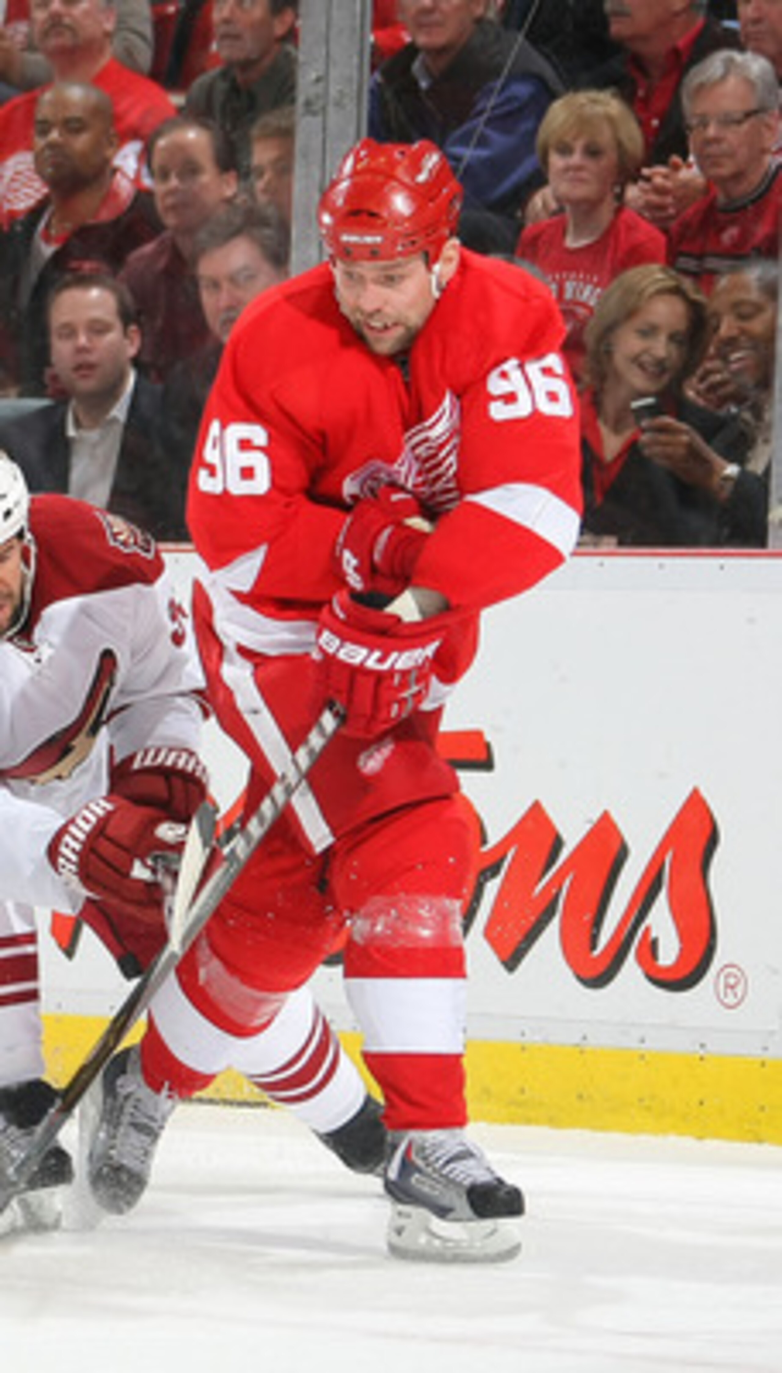 DETROIT,MI- APRIL 13:  Tomas Holmstrom #96 of the Detroit Red Wings attempts a wrap around on Ilya Bryzgalov #30 of the Phoenix Coyotes while Adrian Aucoin #33 of the Phoenix Coyotes defends in Game One of the Western Conference Quarterfinals during the 2