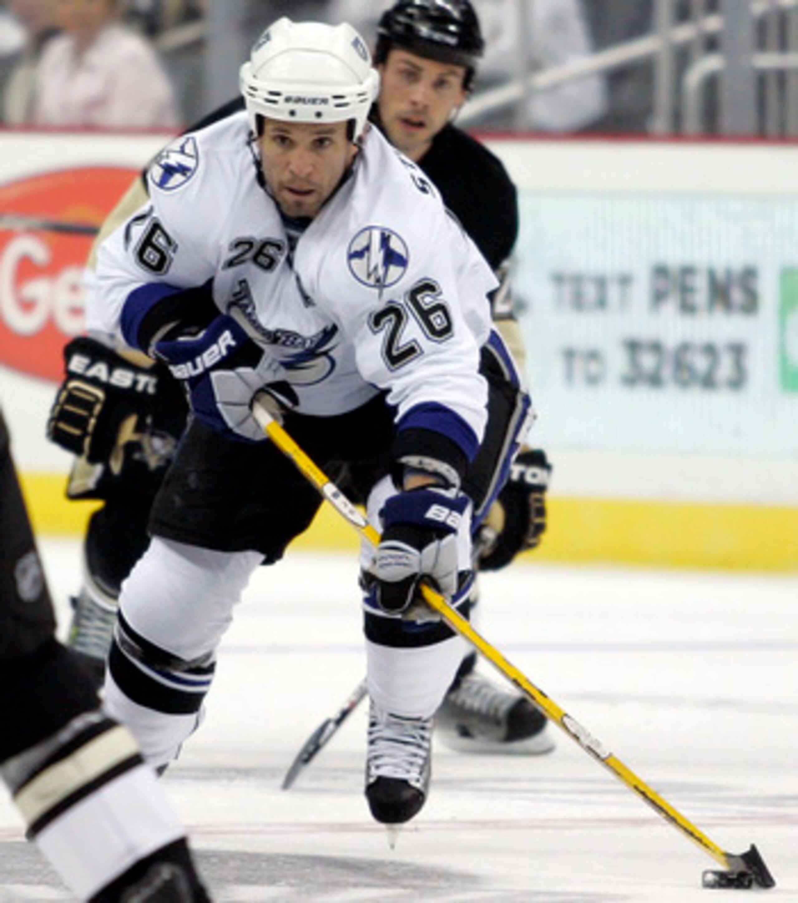 PITTSBURGH, PA - APRIL 13:  Martin St. Louis #26 of the Tampa Bay Lightning handles the puck against the Pittsburgh Penguins in Game One of the Eastern Conference Quarterfinals during the 2011 NHL Stanley Cup Playoffs at Consol Energy Center on April 13,