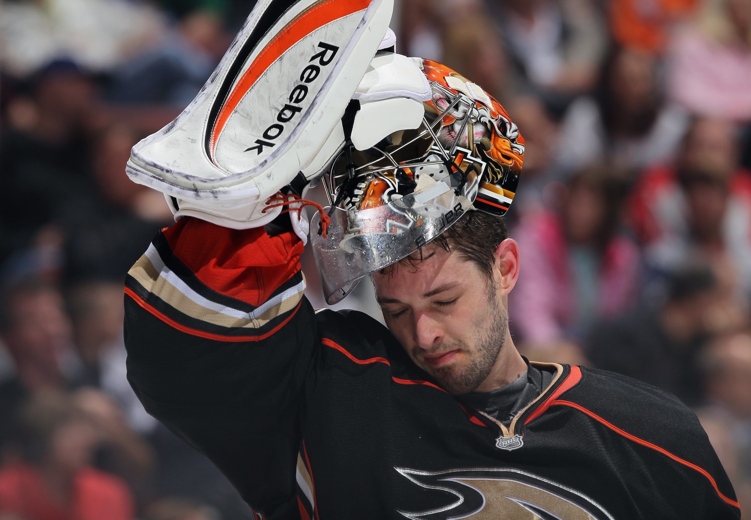 ANAHEIM, CA - APRIL 13:  Goaltender Dan Ellis #38 of the Anaheim Ducks puts his mask on against the Nashville Predators in Game One of the Western Conference Quarterfinals during the 2011 NHL Stanley Cup Playoffs at Honda Center on April 13, 2011 in Anahe