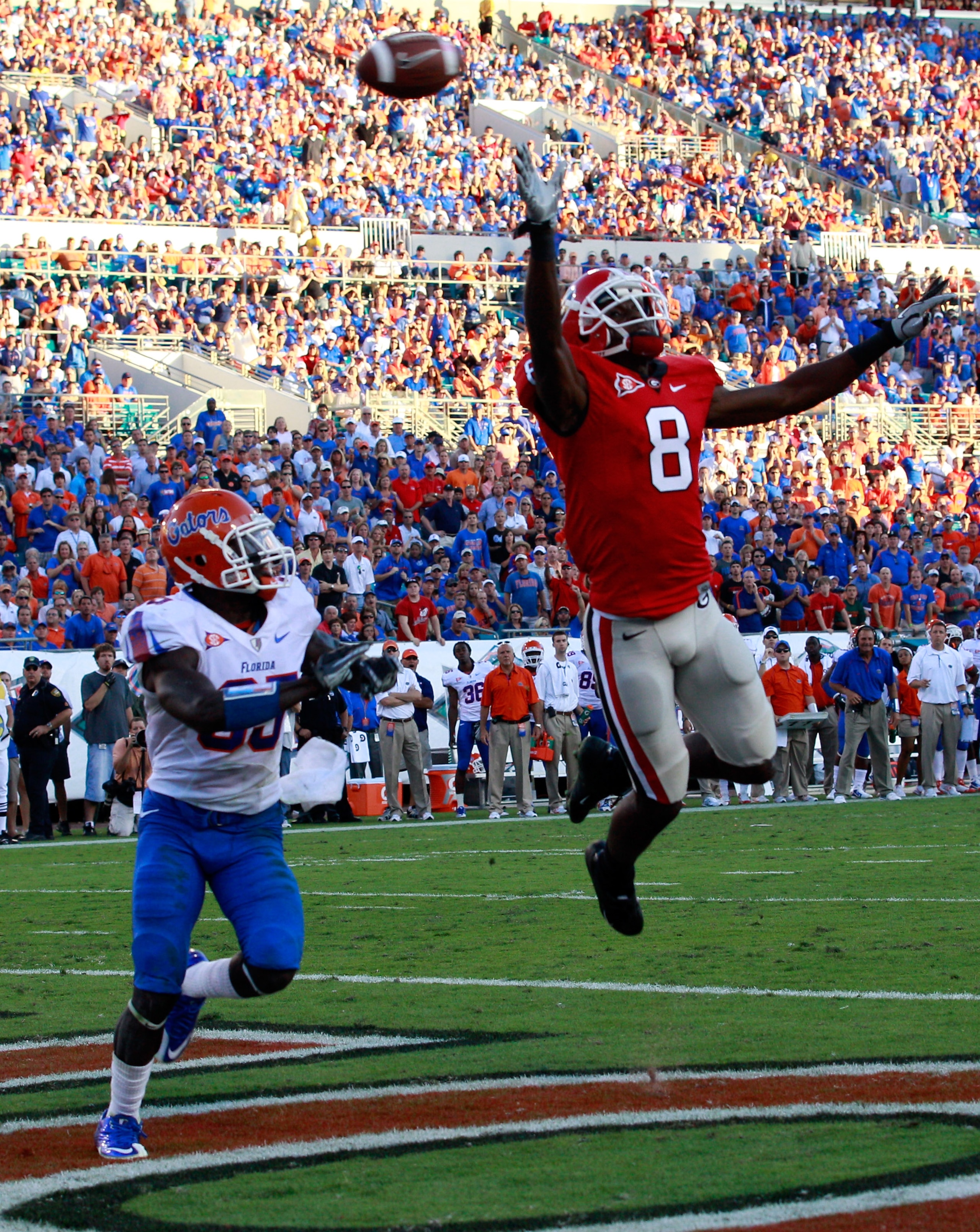 JACKSONVILLE, FL - OCTOBER 30: A.J. Green #8 of the Georgia Bulldogs attempts to catch a pass against Ahmad Black #35 of the Florida Gators during the game at EverBank Field on October 30, 2010 in Jacksonville, Florida. (Photo by Sam Greenwood/Getty Ima JACKSONVILLE, FL - OCTOBER 30: A.J. Green #8 of the Georgia Bulldogs attempts to catch a pass against Ahmad Black #35 of the Florida Gators during the game at EverBank Field on October 30, 2010 in Jacksonville, Florida. (Photo by Sam Greenwood/Getty Ima