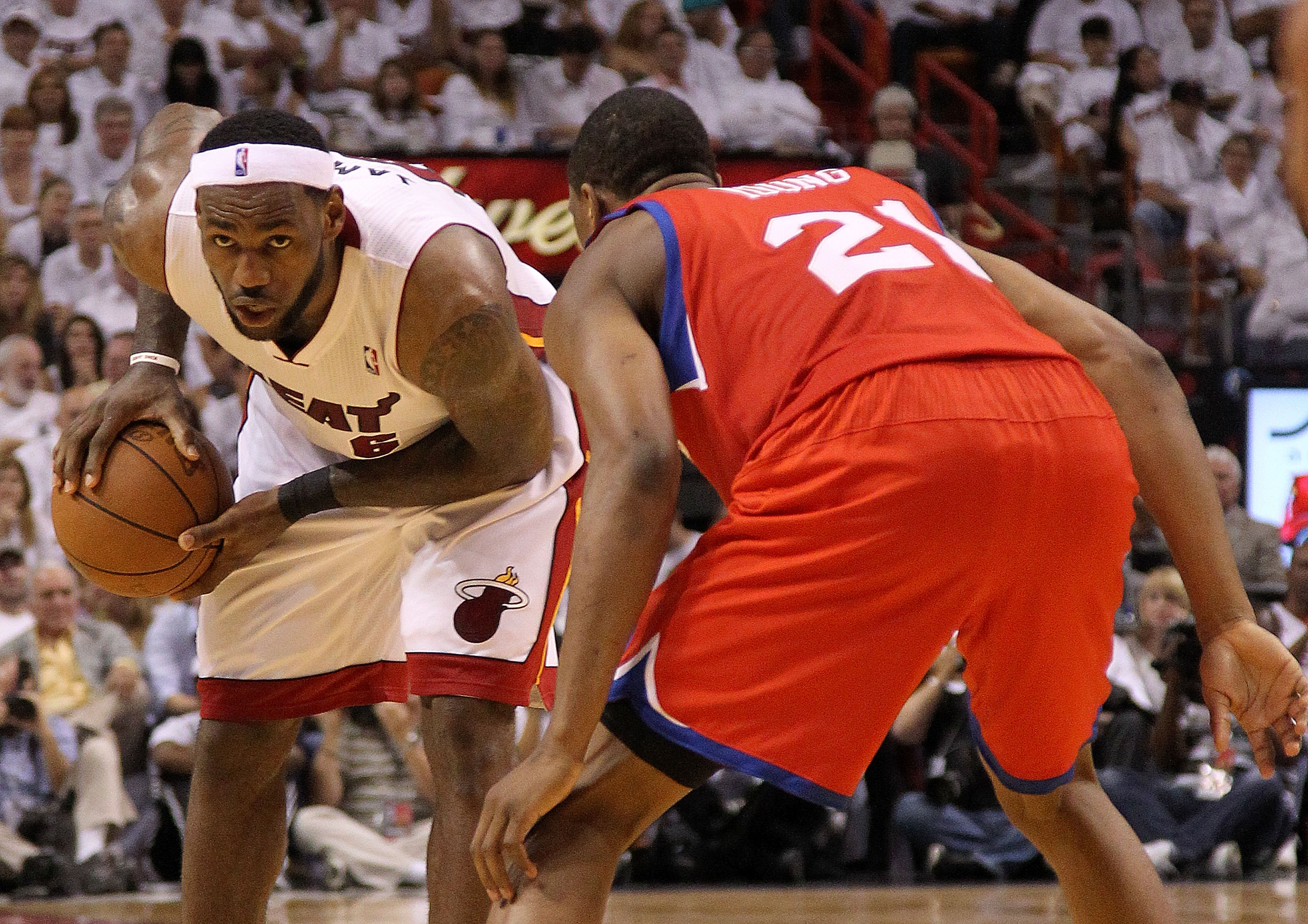 MIAMI, FL - APRIL 18:  LeBron James #6 of the Miami Heat looks to drive around Thaddeus Young #21 of the Philadelphia 76ers during game two of the Eastern Conference Quarterfinals at American Airlines Arena on April 18, 2011 in Miami, Florida. NOTE TO USE