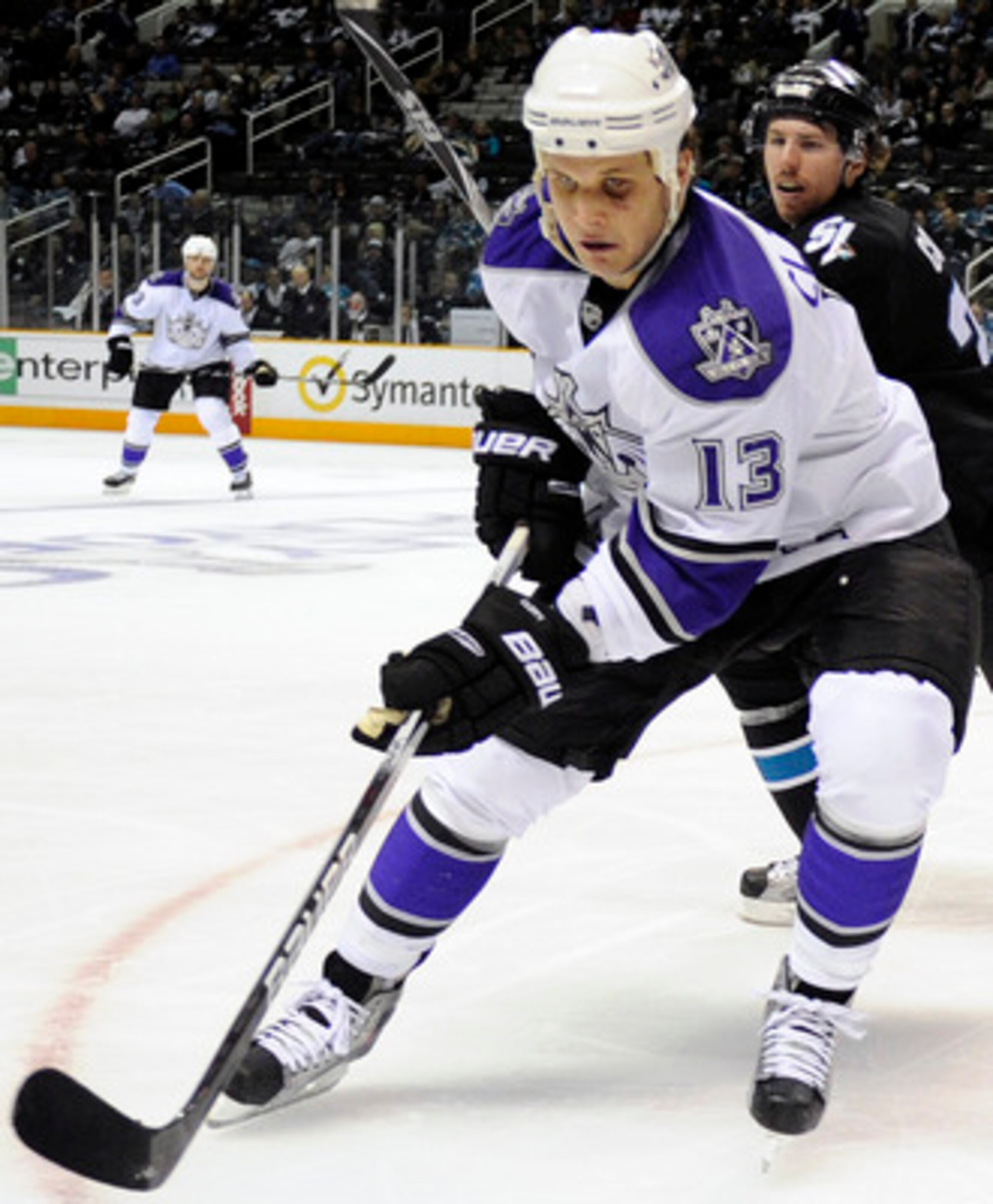 SAN JOSE, CA - APRIL 16: Kyle Clifford #13 of the Los Angeles Kings races for the puck in front of Logan Couture #39 of the San Jose Sharks in Game Two of the Western Conference Quarterfinals  during the 2011 NHL Stanley Cup Playoffs at the HP Pavilion on
