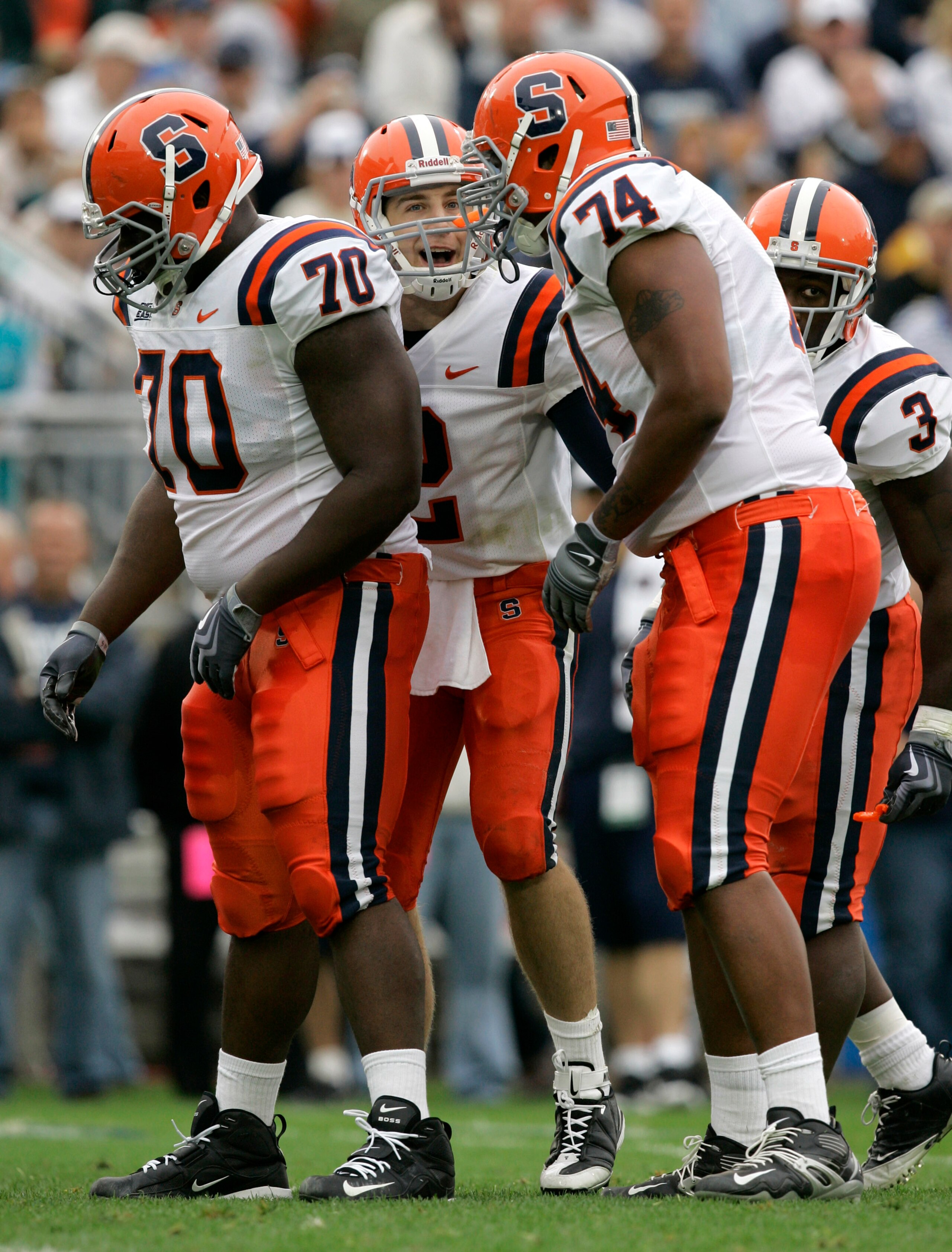 STATE COLLEGE, PA - SEPTEMBER 12: Quarterback Greg Paulus #2 of the Syracuse Orangemen shouts to his linemen Ryan Bartholomew #70, Nick Speller #74, and running back Delone Carter #3 during the second half against the Penn State Nittany Lions at Beaver St STATE COLLEGE, PA - SEPTEMBER 12: Quarterback Greg Paulus #2 of the Syracuse Orangemen shouts to his linemen Ryan Bartholomew #70, Nick Speller #74, and running back Delone Carter #3 during the second half against the Penn State Nittany Lions at Beaver St
