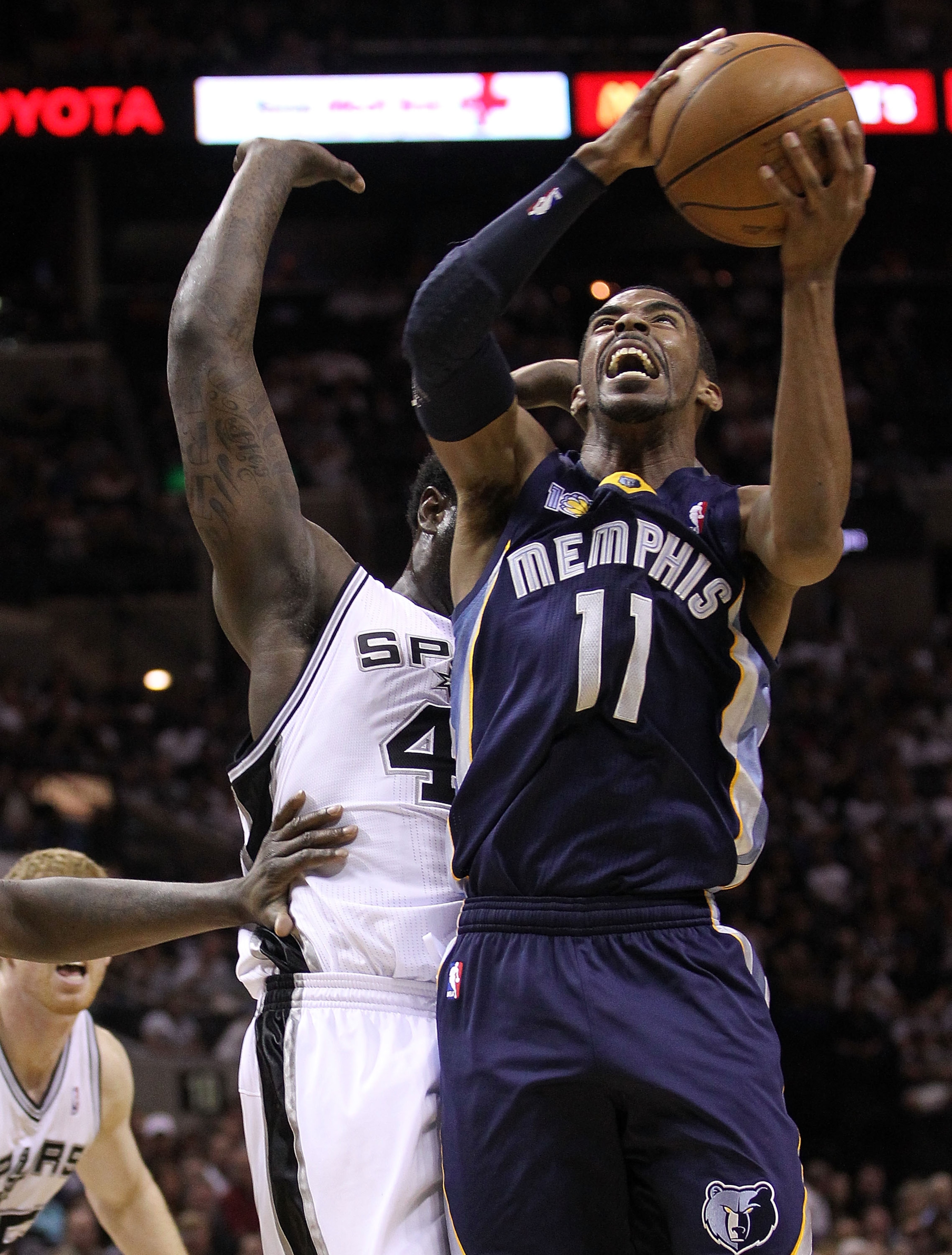 SAN ANTONIO, TX - APRIL 17: Guard Mike Conley #11 of the Memphis Grizzlies takes a shot against DeJuan Blair #45 of the San Antonio Spurs in Game One of the Western Conference Quarterfinals in the 2011 NBA Playoffs on April 17, 2011 at AT&T Center in San SAN ANTONIO, TX - APRIL 17: Guard Mike Conley #11 of the Memphis Grizzlies takes a shot against DeJuan Blair #45 of the San Antonio Spurs in Game One of the Western Conference Quarterfinals in the 2011 NBA Playoffs on April 17, 2011 at AT&T Center in San