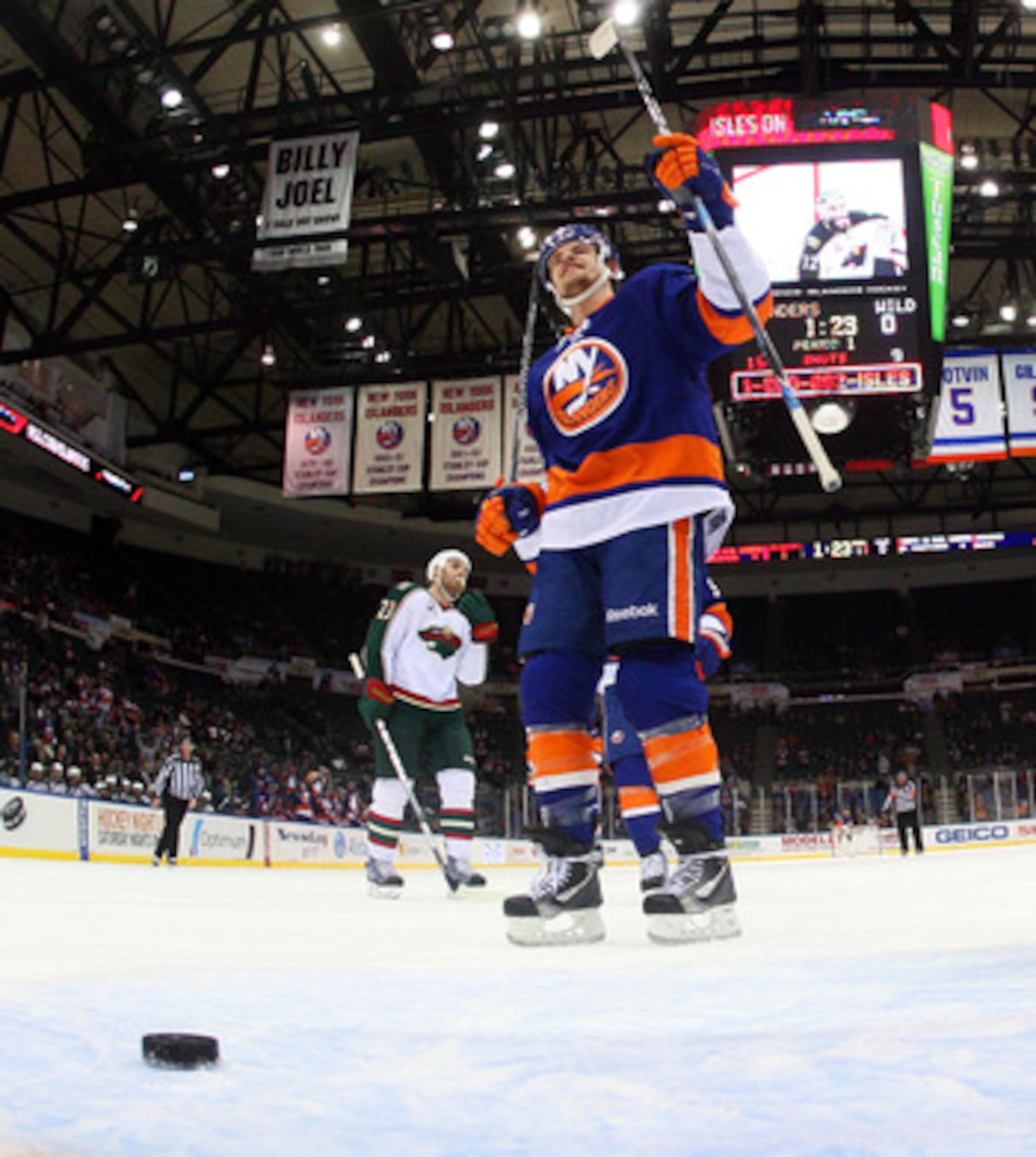 UNIONDALE, NY - MARCH 02: Michael Grabner #40 of the New York Islanders celebrates a goal against the Minnesota Wild at the Nassau Coliseum on March 2, 2011 in Uniondale, New York. The Islanders defeated the Wild 4-1. (Photo by Bruce Bennett/Getty Images UNIONDALE, NY - MARCH 02: Michael Grabner #40 of the New York Islanders celebrates a goal against the Minnesota Wild at the Nassau Coliseum on March 2, 2011 in Uniondale, New York. The Islanders defeated the Wild 4-1. (Photo by Bruce Bennett/Getty Images