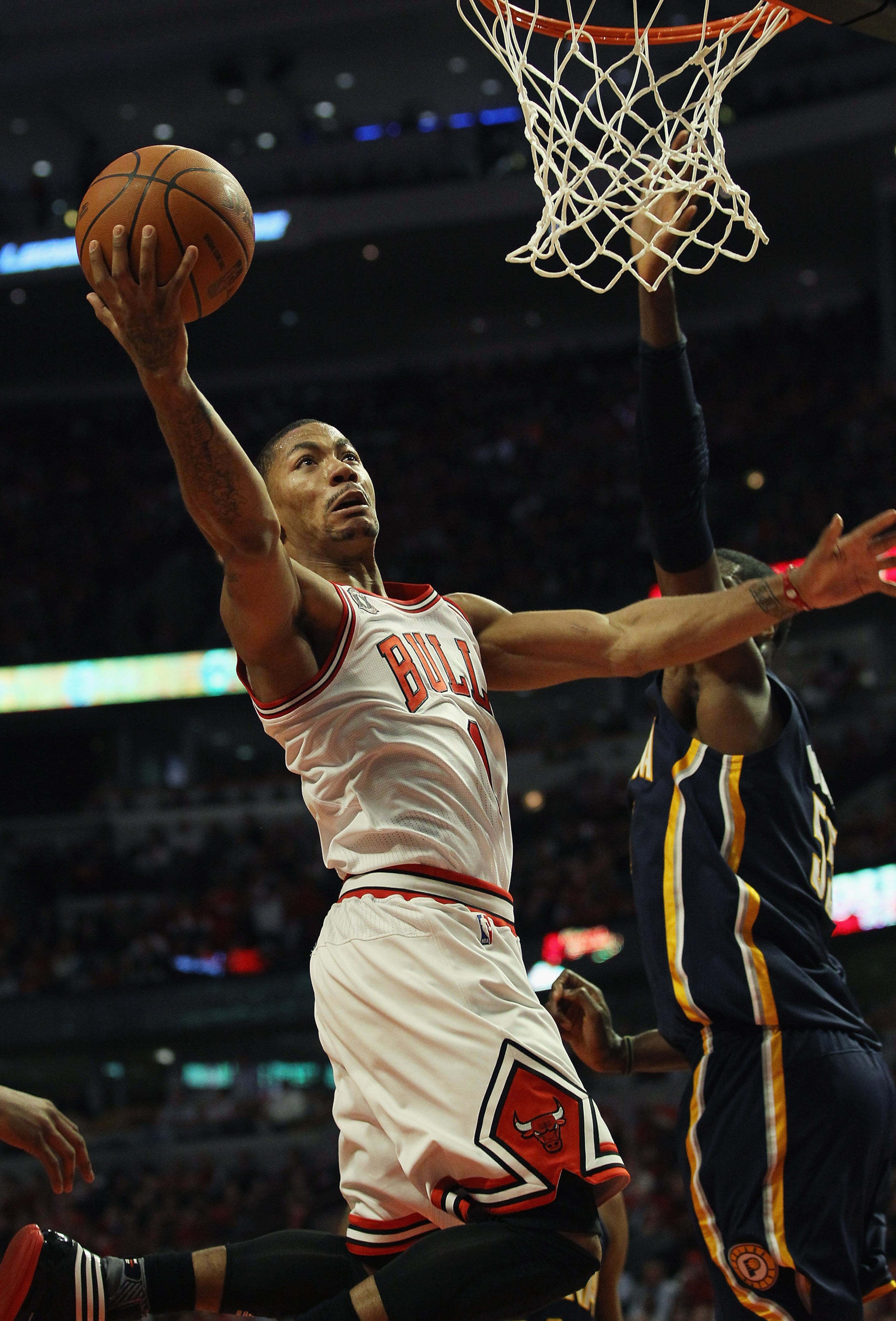 CHICAGO, IL - APRIL 18: Derrick Rose #1 of the Chicago Bulls puts up a shot on his way to a game-high 36 points against Roy Hibbert #55 of the Indiana Pacers in Game Two of the Eastern Conference Quarterfinals in the 2011 NBA Playoffs at the United Center