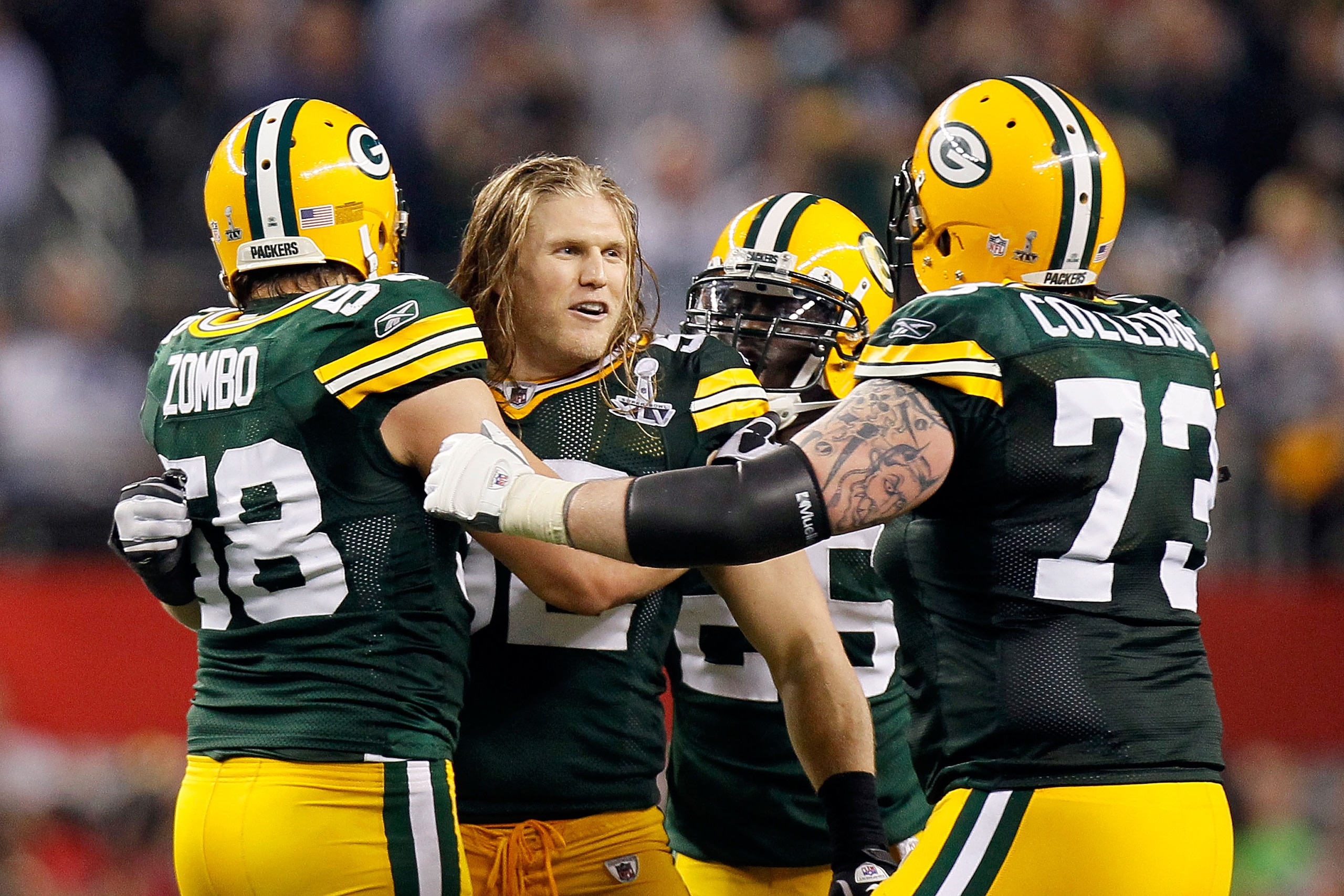 ARLINGTON, TX - FEBRUARY 06:  Clay Matthews #52 of the Green Bay Packers celebrates with teammates Frank Zombo #58 and Daryn Colledge #73 in the final minute of the Packers 31-25 win against the Pittsburgh Steelers during Super Bowl XLV at Cowboys Stadium
