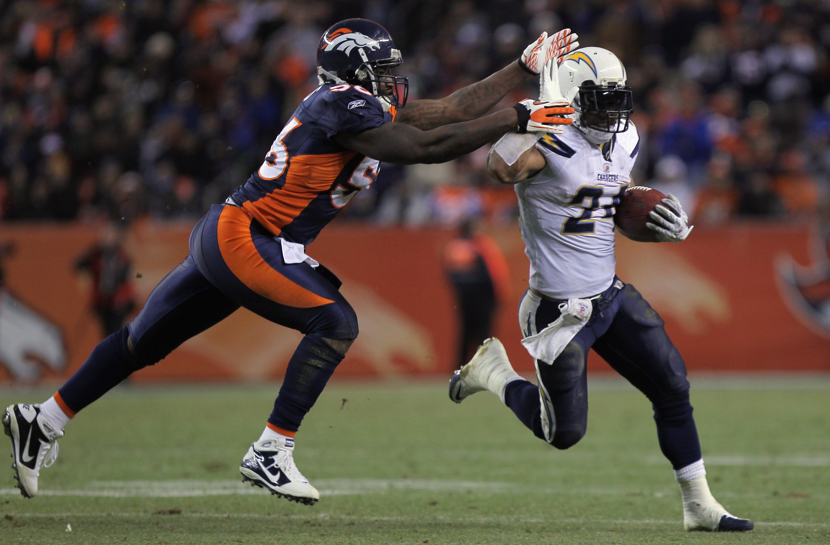 DENVER - JANUARY 02: Running back Ryan Mathews #24 of the San Diego Chargers eludes linebacker Robert Ayers #56 of the Denver Broncos as he rushes for a 31 yard touchdown on fourth down and one yard to go in the fourth quarter at INVESCO Field at Mile Hi DENVER - JANUARY 02: Running back Ryan Mathews #24 of the San Diego Chargers eludes linebacker Robert Ayers #56 of the Denver Broncos as he rushes for a 31 yard touchdown on fourth down and one yard to go in the fourth quarter at INVESCO Field at Mile Hi