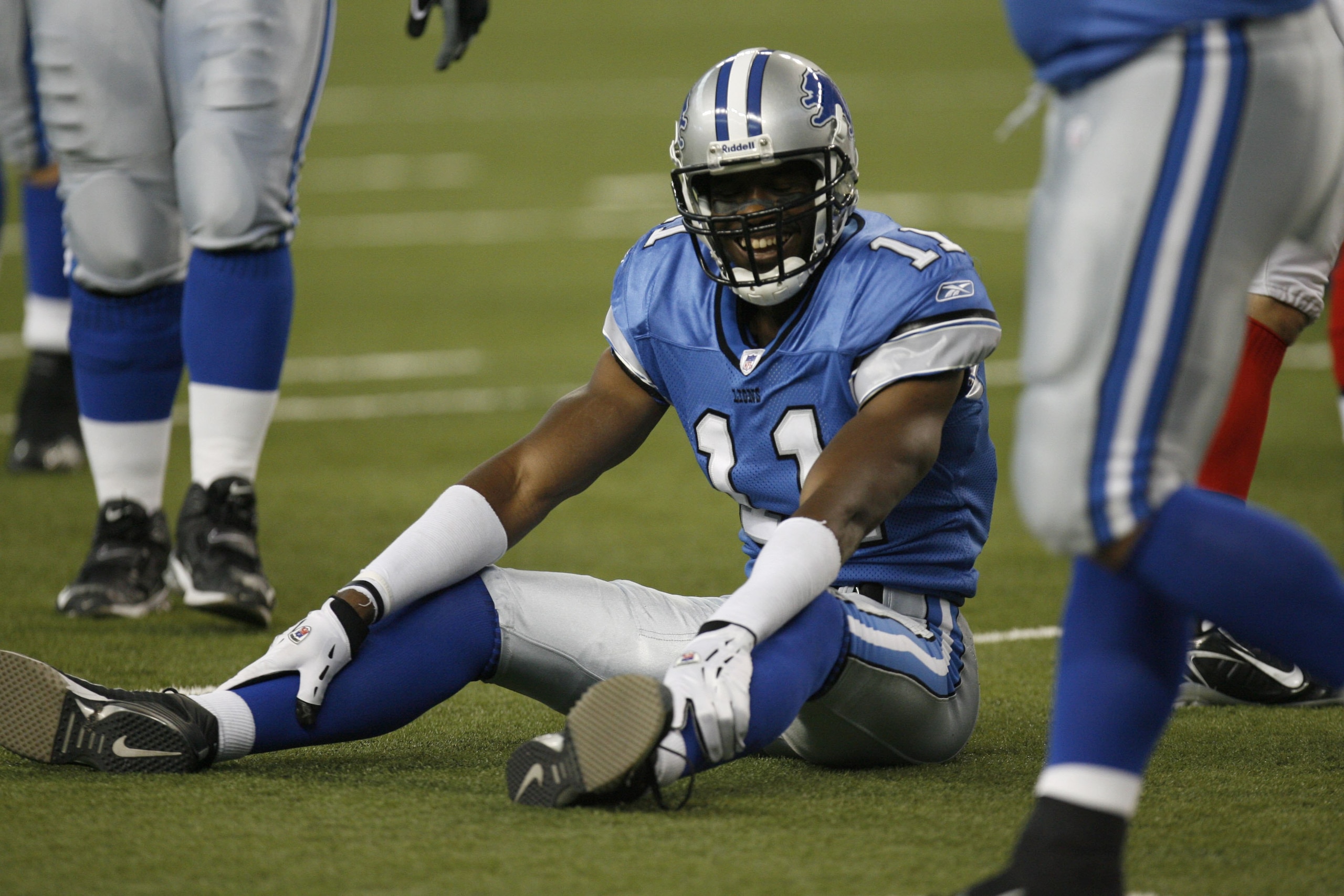 DETROIT - OCTOBER 15:  Wide receiver Roy Williams #11 of the Detroit Lions smiles after a play against the Buffalo Bills during the game on October 15, 2006 at Ford Field in Detroit, Michigan. The Lions won 20-17.  (Photo By Gregory Shamus/Getty Images)