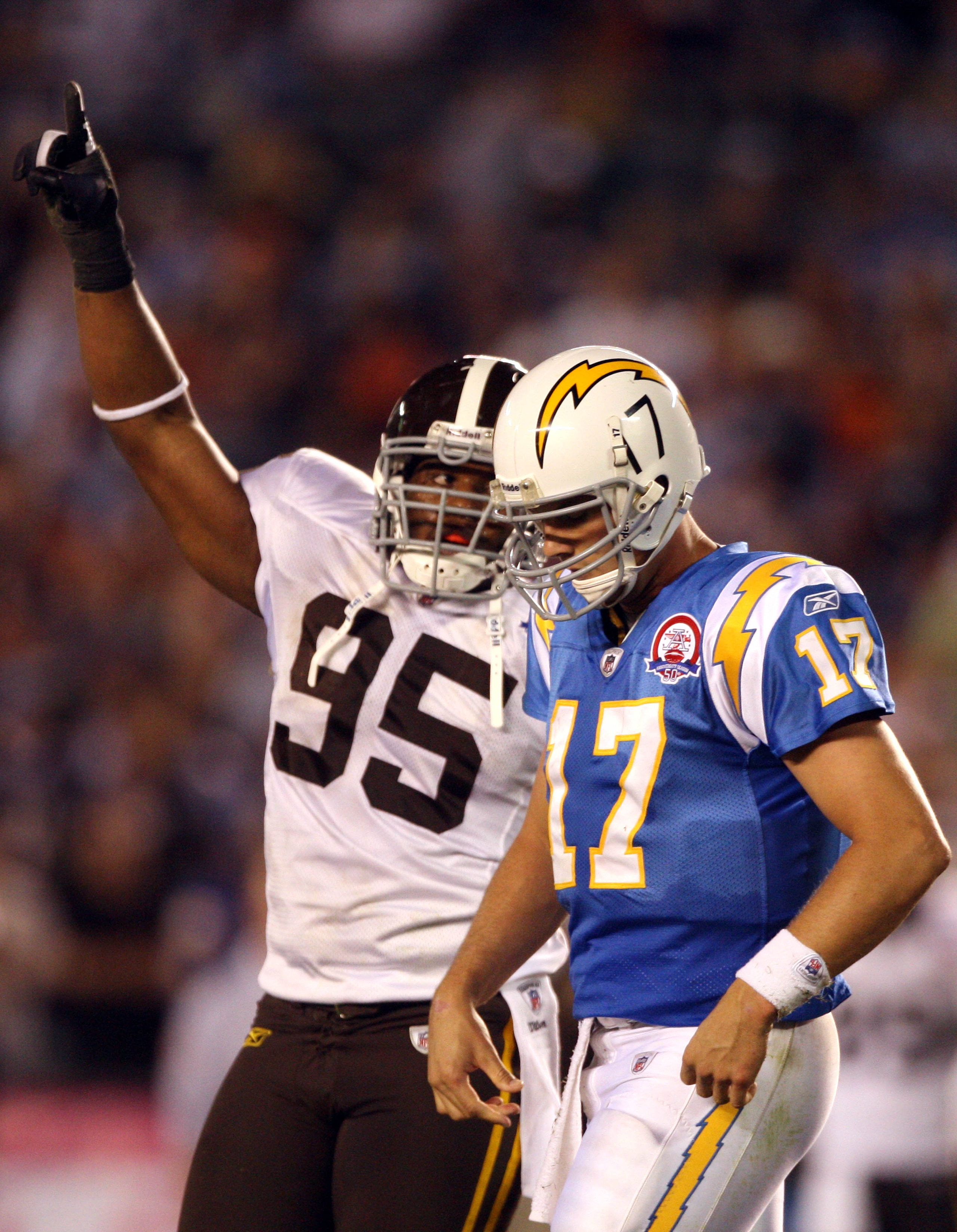SAN DIEGO, CA - OCTOBER 19: Quarterback Phillip Rivers #17 of the San Diego Chargers looks down after the loss of down while Defensive Linebacker Darrell Reid #95 of the Denver Broncos celebrates during the second half during Monday Night Football on Oct SAN DIEGO, CA - OCTOBER 19: Quarterback Phillip Rivers #17 of the San Diego Chargers looks down after the loss of down while Defensive Linebacker Darrell Reid #95 of the Denver Broncos celebrates during the second half during Monday Night Football on Oct