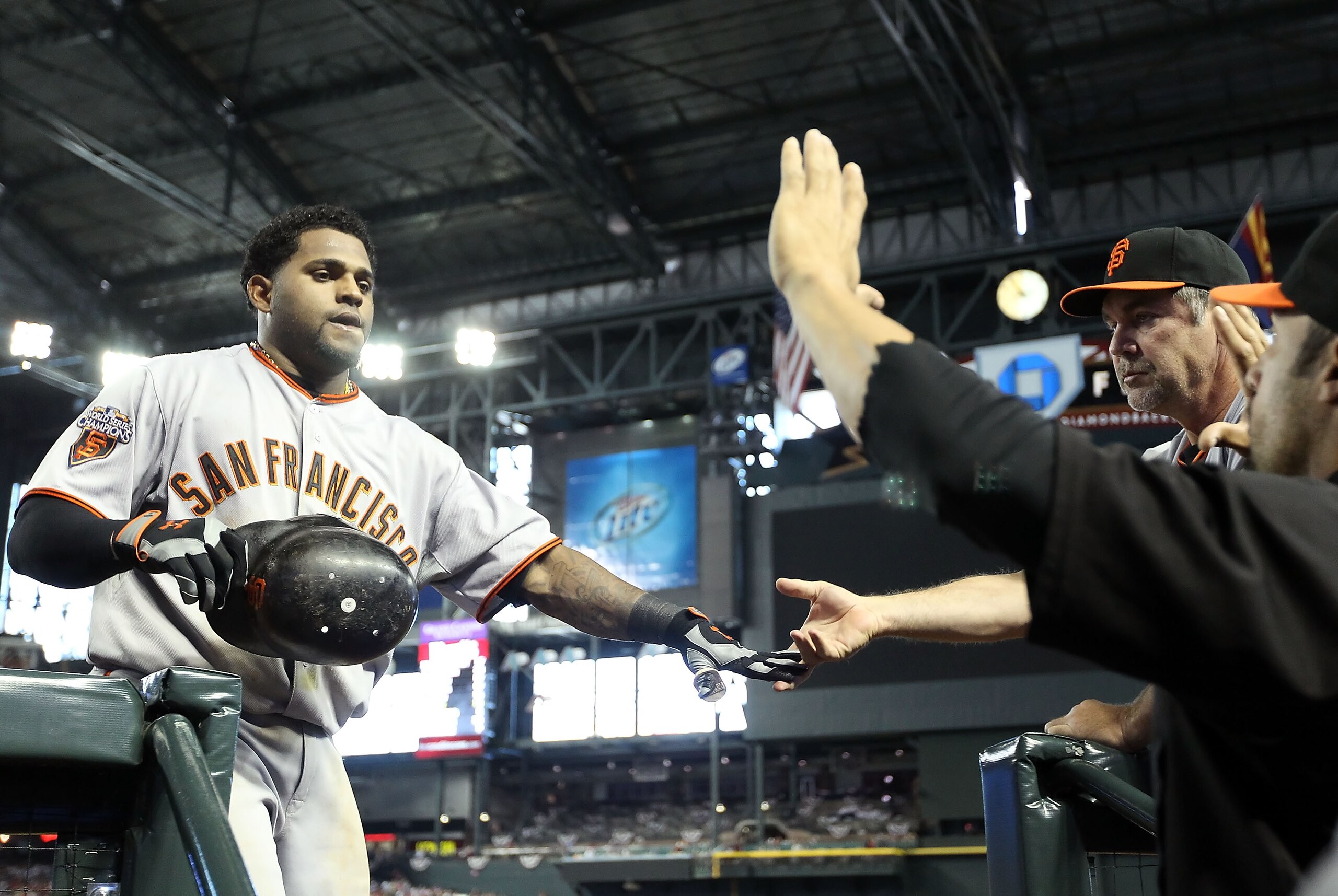 PHOENIX, AZ - APRIL 17:  Pablo Sandoval #48 of the San Francisco Giants high fives manager Bruce Bochy after Sandoval hit a solo home run against the Arizona Diamondbacks during the sixth inning of the Major League Baseball game at Chase Field on April 17