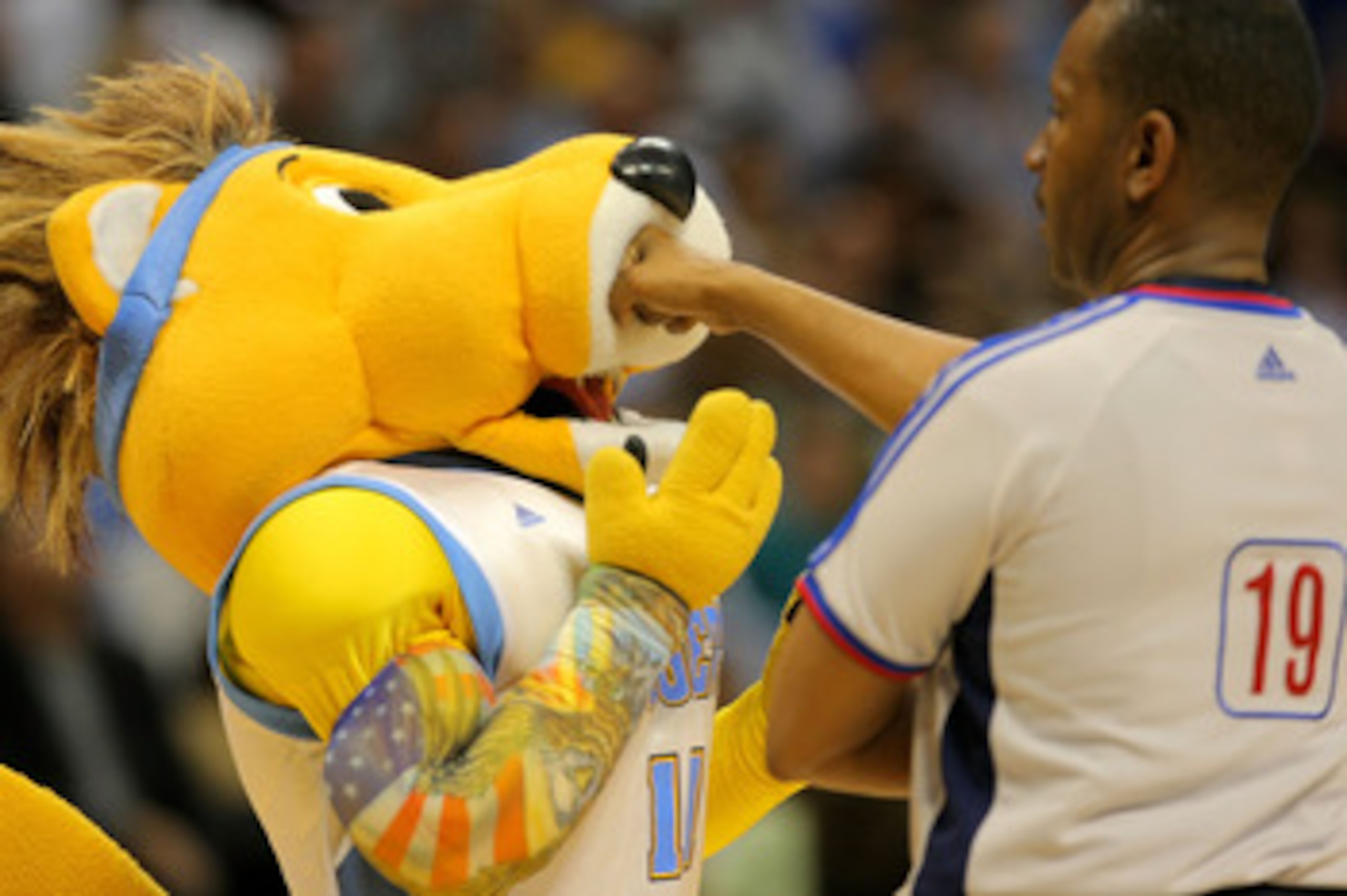DENVER - MAY 23:  Referee James Capers #19 playfully punches Denver Nuggets mascot Rocky in the face during a break in Game Three of the Western Conference Finals during the 2009 NBA Playoffs against the Los Angeles Lakers at Staples Center on May 23, 200