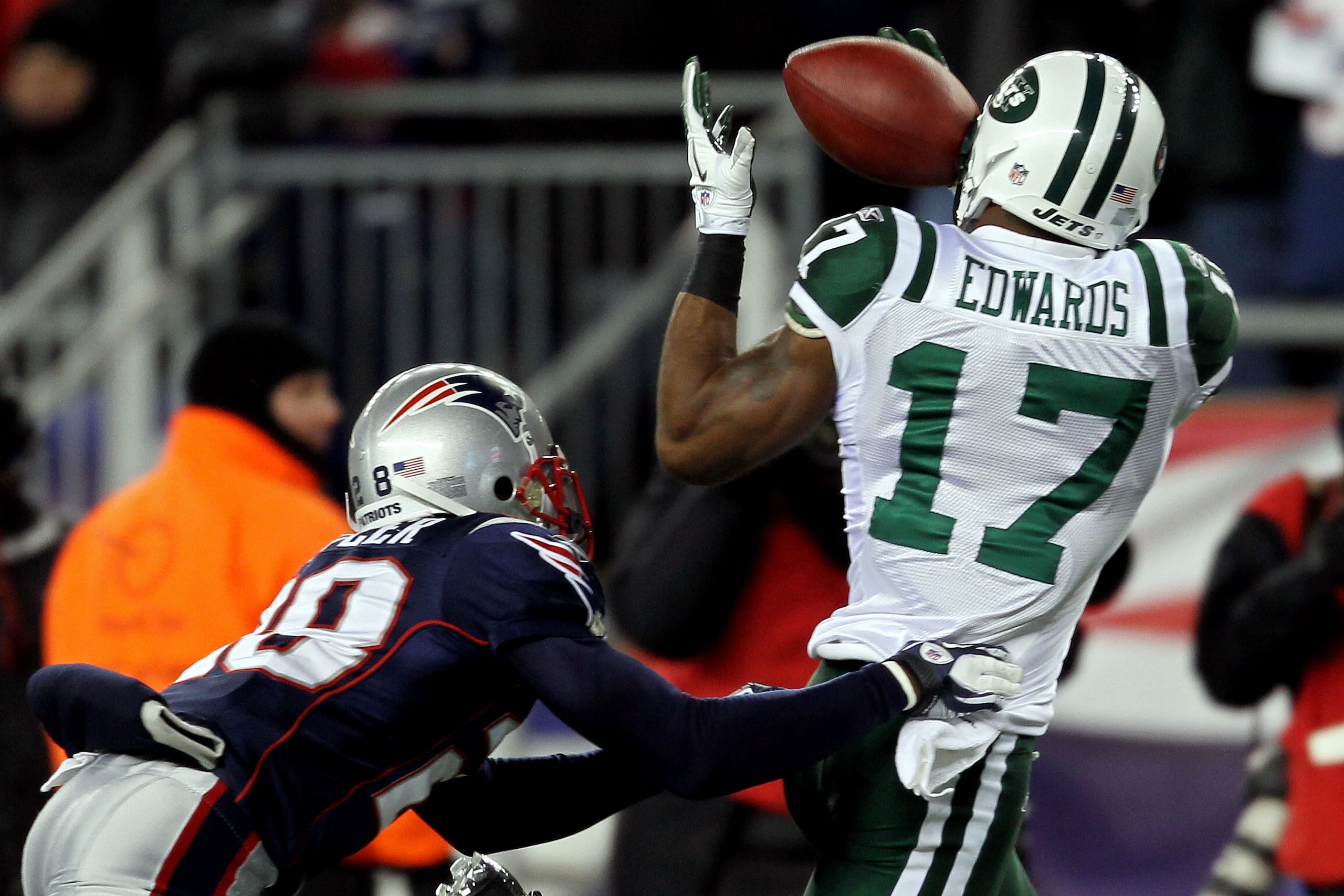 FOXBORO, MA - JANUARY 16:  Braylon Edwards #17 of the New York Jets catches a pass over Darius Butler #28 of the New England Patriots in the second quarter during their 2011 AFC divisional playoff game at Gillette Stadium on January 16, 2011 in Foxboro, M