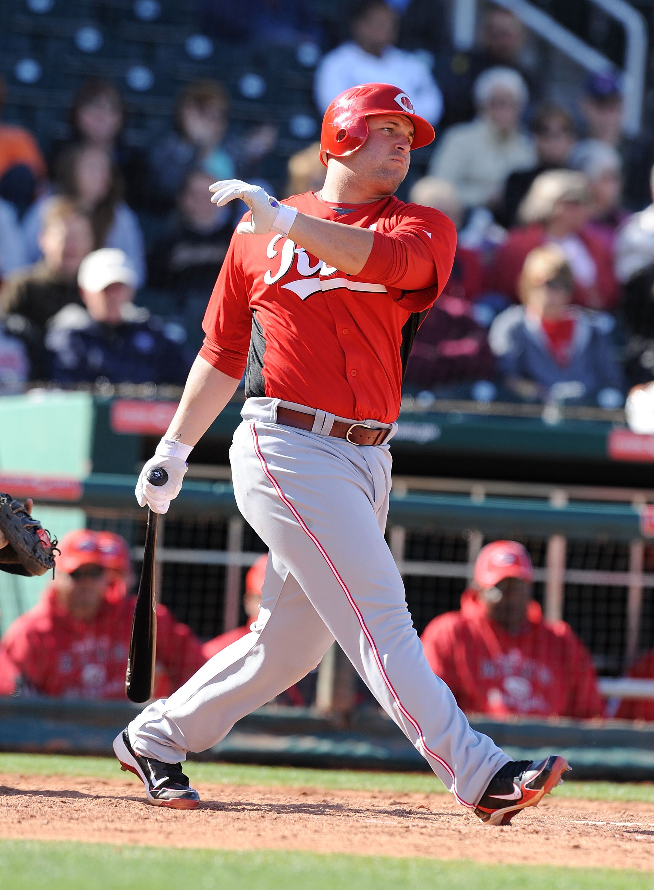 GOODYEAR, AZ - FEBRUARY 27:  Yonder Alonso #23 of the Cincinnati Reds follows through on a swing against the Cleveland Indians at Goodyear Ballpark on February 27, 2011 in Goodyear, Arizona.  (Photo by Norm Hall/Getty Images)