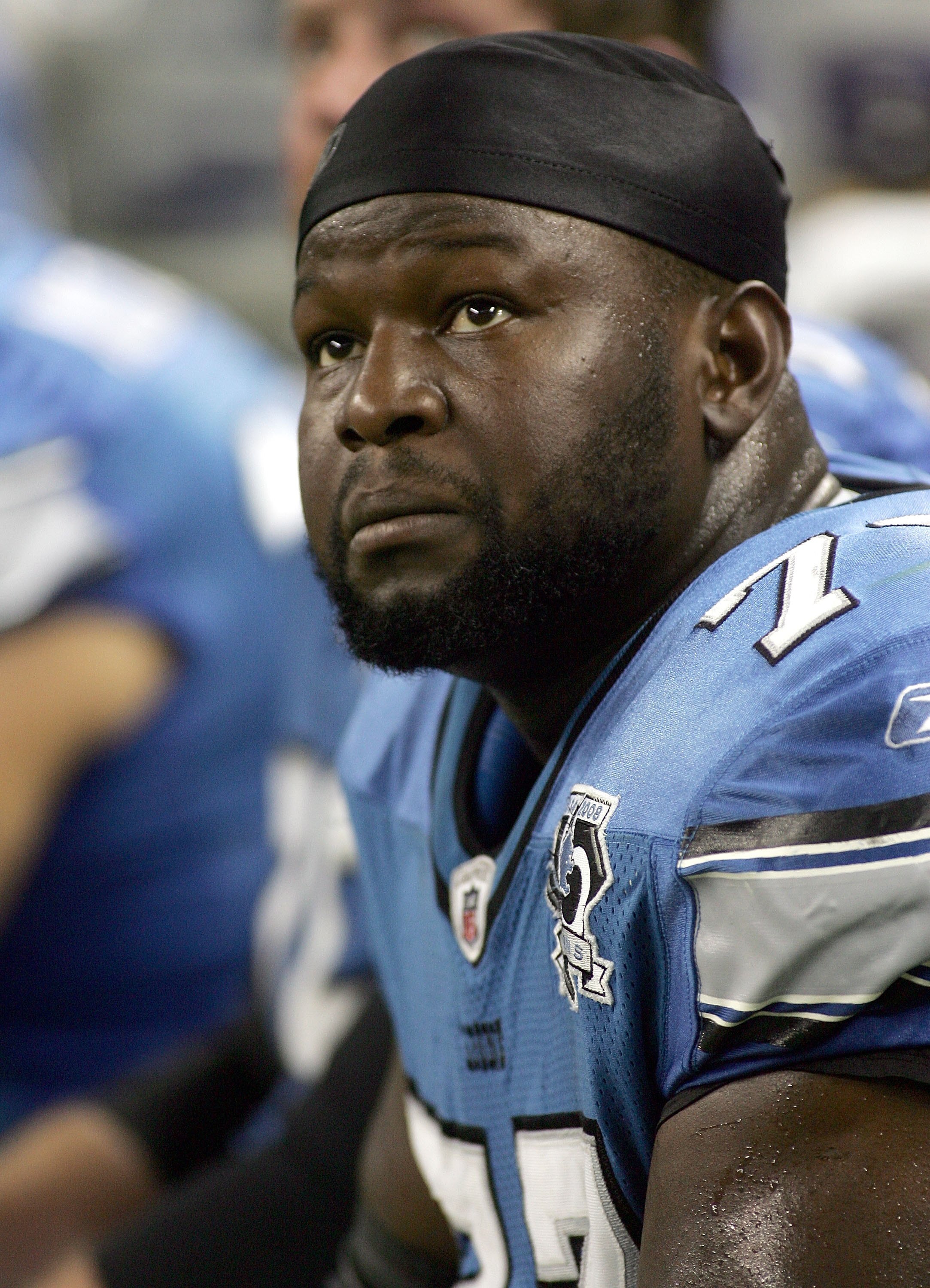 DETROIT - SEPTEMBER 14:  Gosder Cherilus #77 of the Detroit Lions sits on the bench during the Green Bay Packers vs. Detroit Lions on September 14, 2008 at Ford Field in Detroit, Michigan.  (Photo by Domenic Centofanti/Getty Images)