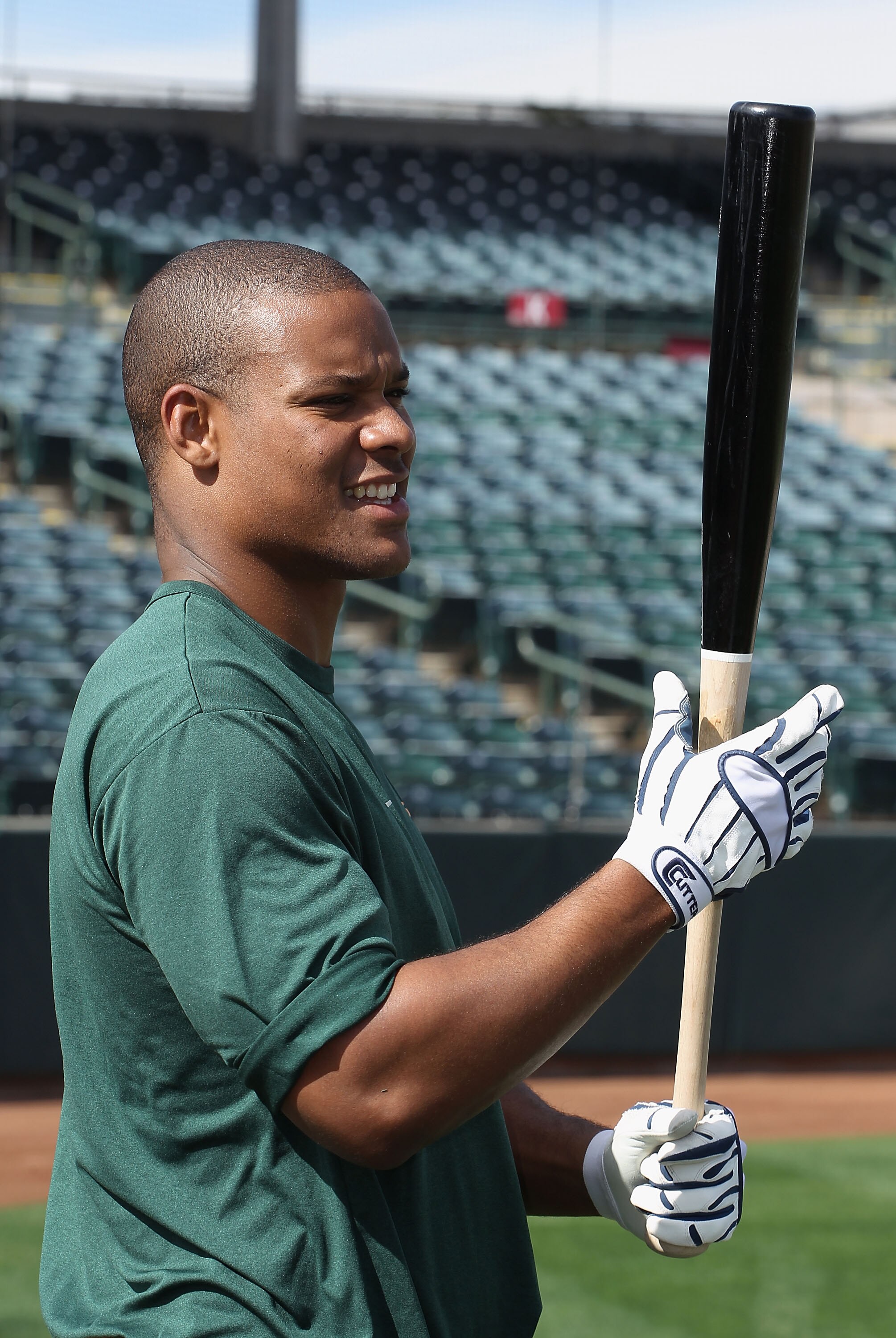 PHOENIX, AZ - FEBRUARY 16:  Michael Taylor #23 of the Oakland Athletics takes batting practice during a MLB spring training practice at Phoenix Municipal Stadium on February 16, 2011 in Phoenix, Arizona.  (Photo by Christian Petersen/Getty Images)