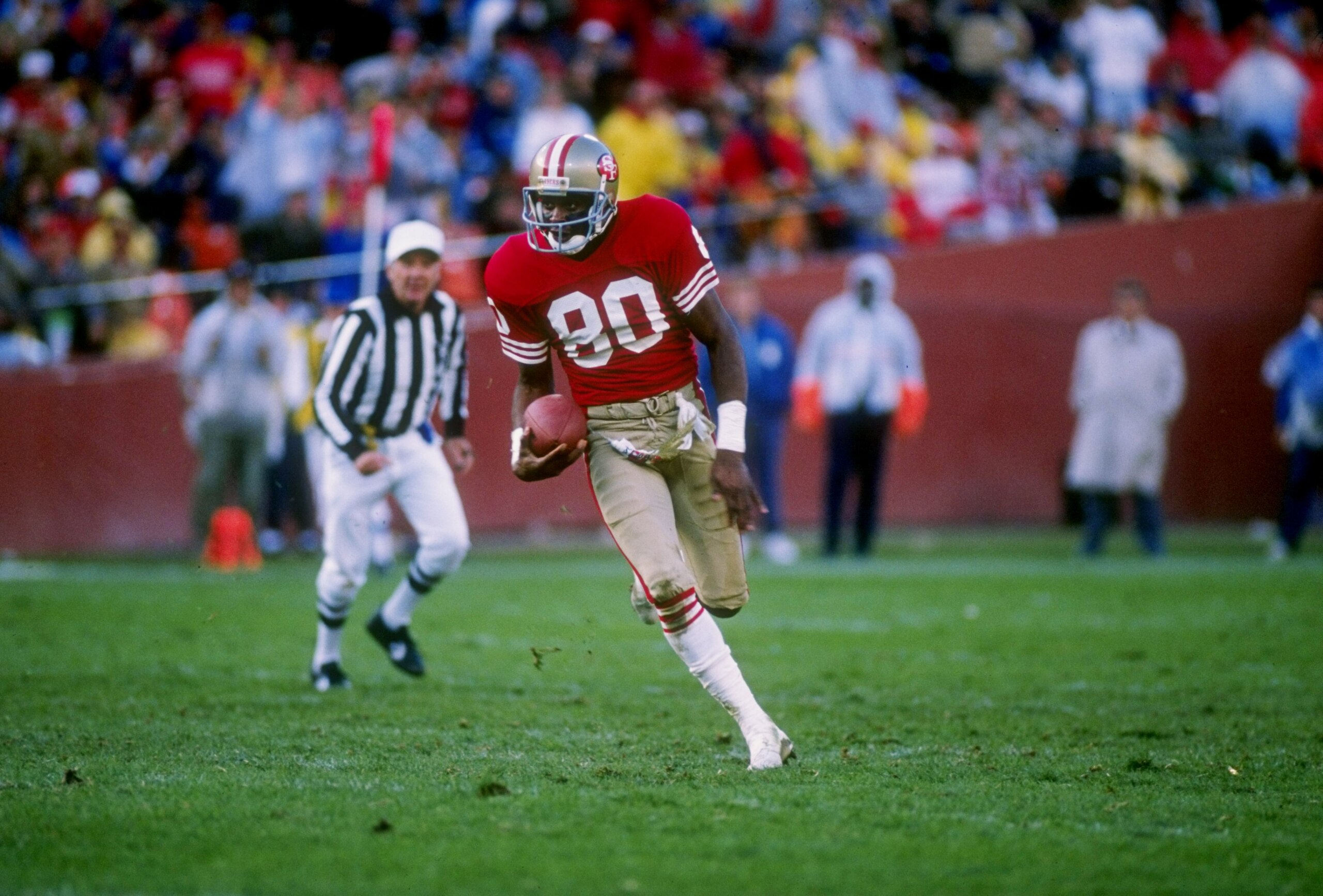 13 Oct 1988: Wide receiver Jerry Rice of the San Francisco 49ers runs down the field during a game against the Los Angeles Raiders at Candlestick Park in San Francisco, California. The Raiders won the game 9-3. 13 Oct 1988: Wide receiver Jerry Rice of the San Francisco 49ers runs down the field during a game against the Los Angeles Raiders at Candlestick Park in San Francisco, California. The Raiders won the game 9-3.