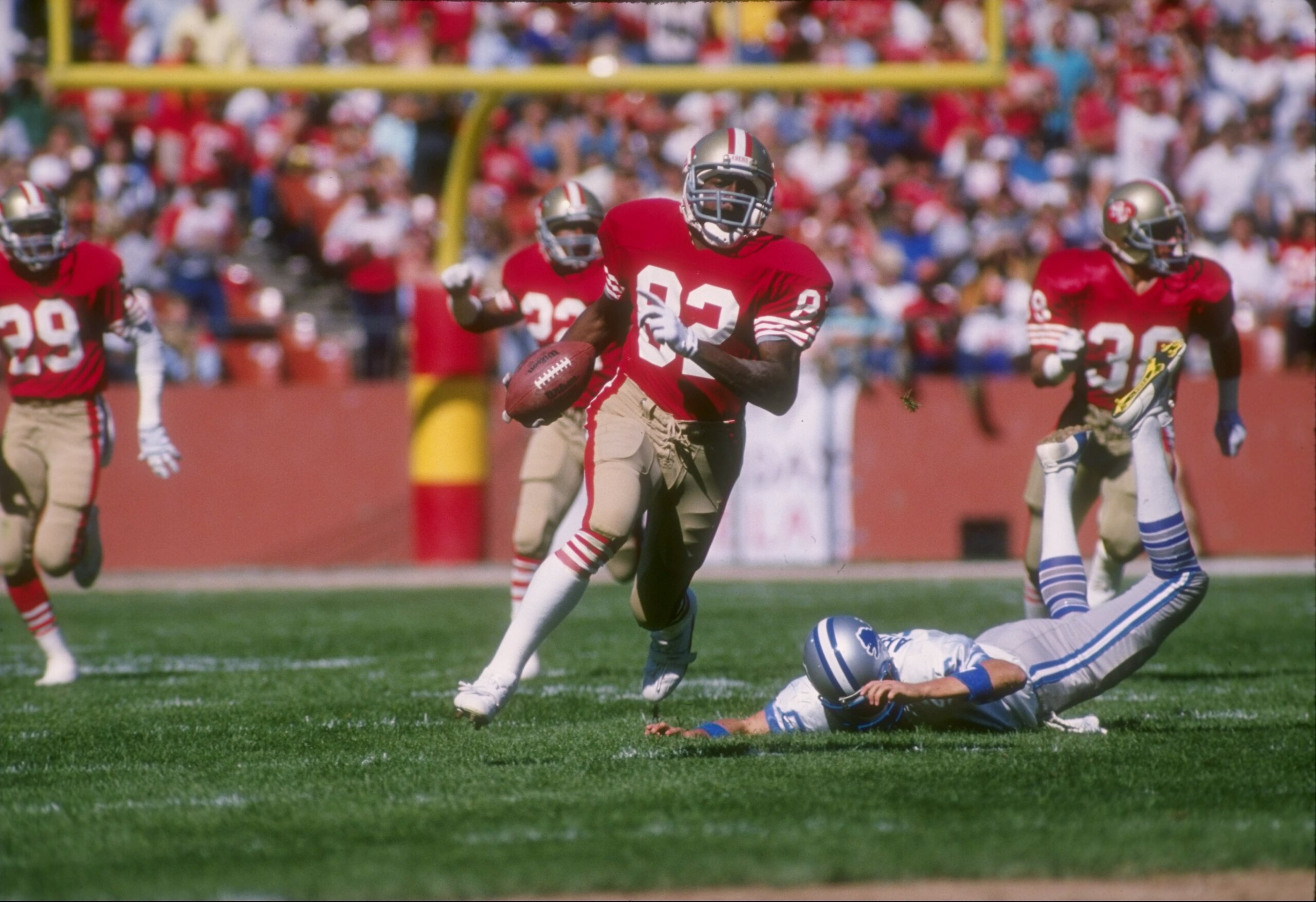 2 Oct 1988: Wide receiver John Taylor of the San Francisco 49ers runs with the ball during a game against the Detroit Lions at Candlestick Park in San Francisco, California. The 49ers won the game, 20-13. Mandatory Credit: Otto Greule /Allsport 2 Oct 1988: Wide receiver John Taylor of the San Francisco 49ers runs with the ball during a game against the Detroit Lions at Candlestick Park in San Francisco, California. The 49ers won the game, 20-13. Mandatory Credit: Otto Greule /Allsport