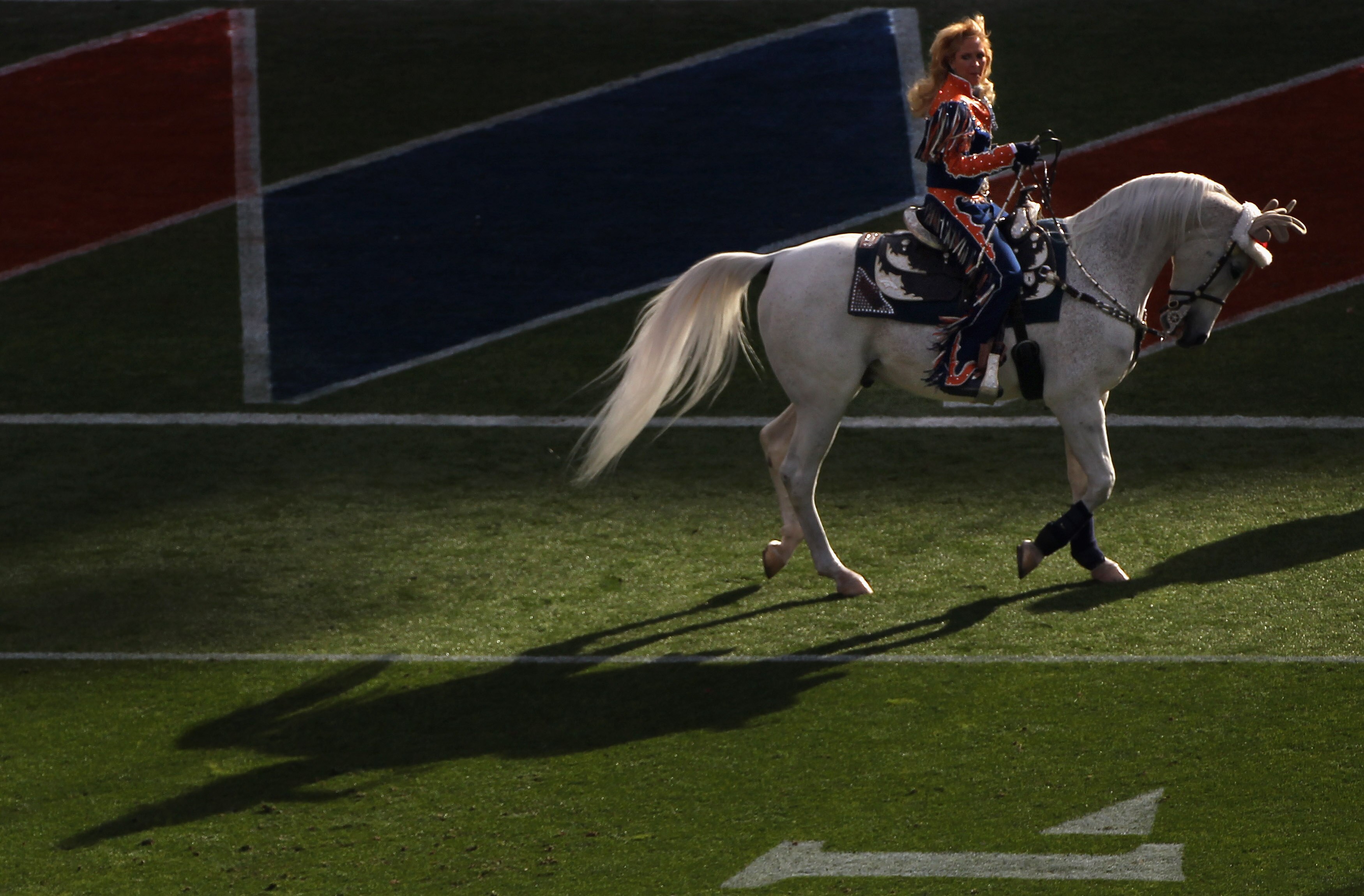 DENVER - DECEMBER 26:  Ann Judge-Wegener rides Thunder on the field prior to the game as the Denver Broncos host the Houston Texas at INVESCO Field at Mile High on December 26, 2010 in Denver, Colorado. The Broncos defeated the Texans 24-23.  (Photo by Do