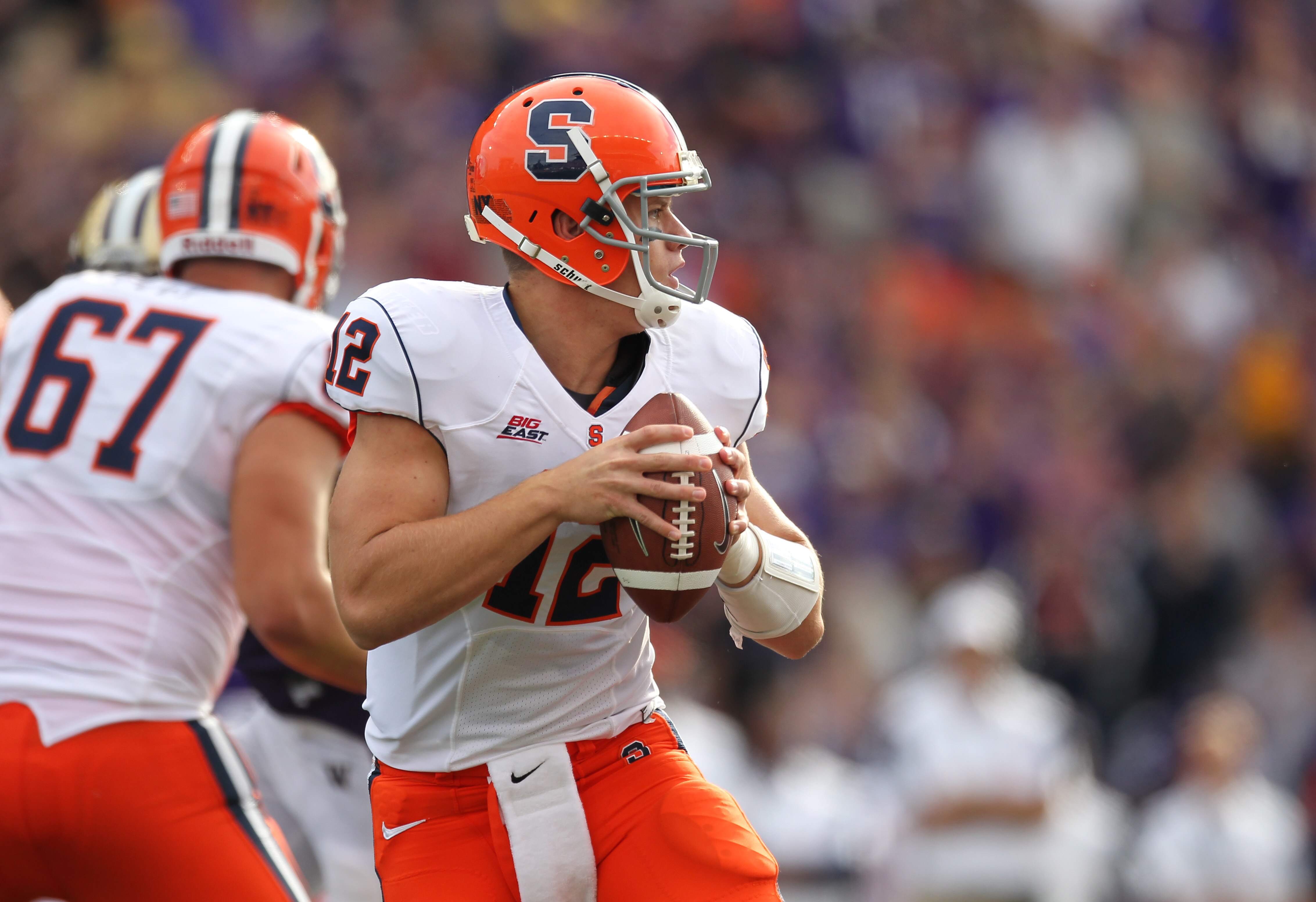 SEATTLE - SEPTEMBER 11:  Quarterback Ryan Nassib #12 of the Syracuse Orange looks to pass against the Washington Huskies on September 11, 2010 at Husky Stadium in Seattle, Washington. (Photo by Otto Greule Jr/Getty Images)