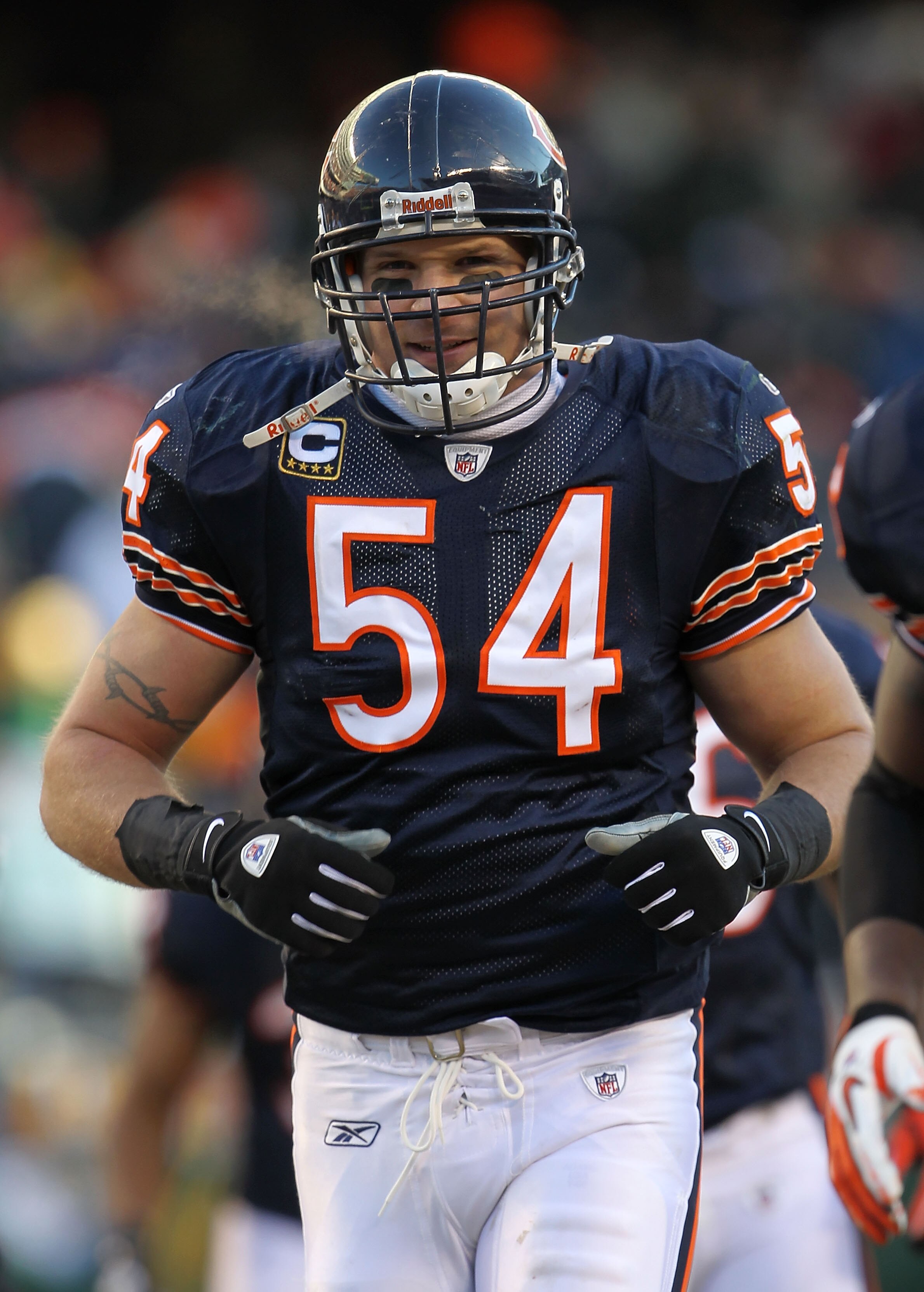CHICAGO, IL - JANUARY 23:  Brian Urlacher #54 of the Chicago Bears smiles while taking on the Green Bay Packers in the NFC Championship Game at Soldier Field on January 23, 2011 in Chicago, Illinois.  (Photo by Jamie Squire/Getty Images)