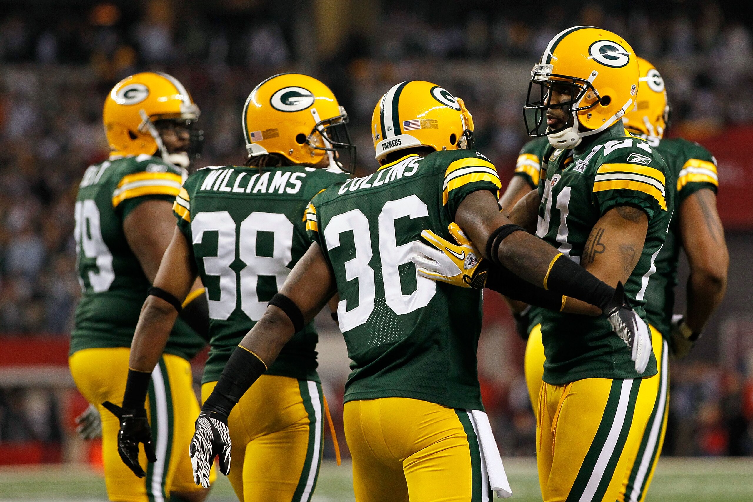 ARLINGTON, TX - FEBRUARY 06: Charles Woodson (R) #21 of the Green Bay Packers congratulates Nick Collins #36 after COllins scored a touchdown on an interception return against the Pittsburgh Steelers during Super Bowl XLV at Cowboys Stadium on February 6 ARLINGTON, TX - FEBRUARY 06: Charles Woodson (R) #21 of the Green Bay Packers congratulates Nick Collins #36 after COllins scored a touchdown on an interception return against the Pittsburgh Steelers during Super Bowl XLV at Cowboys Stadium on February 6