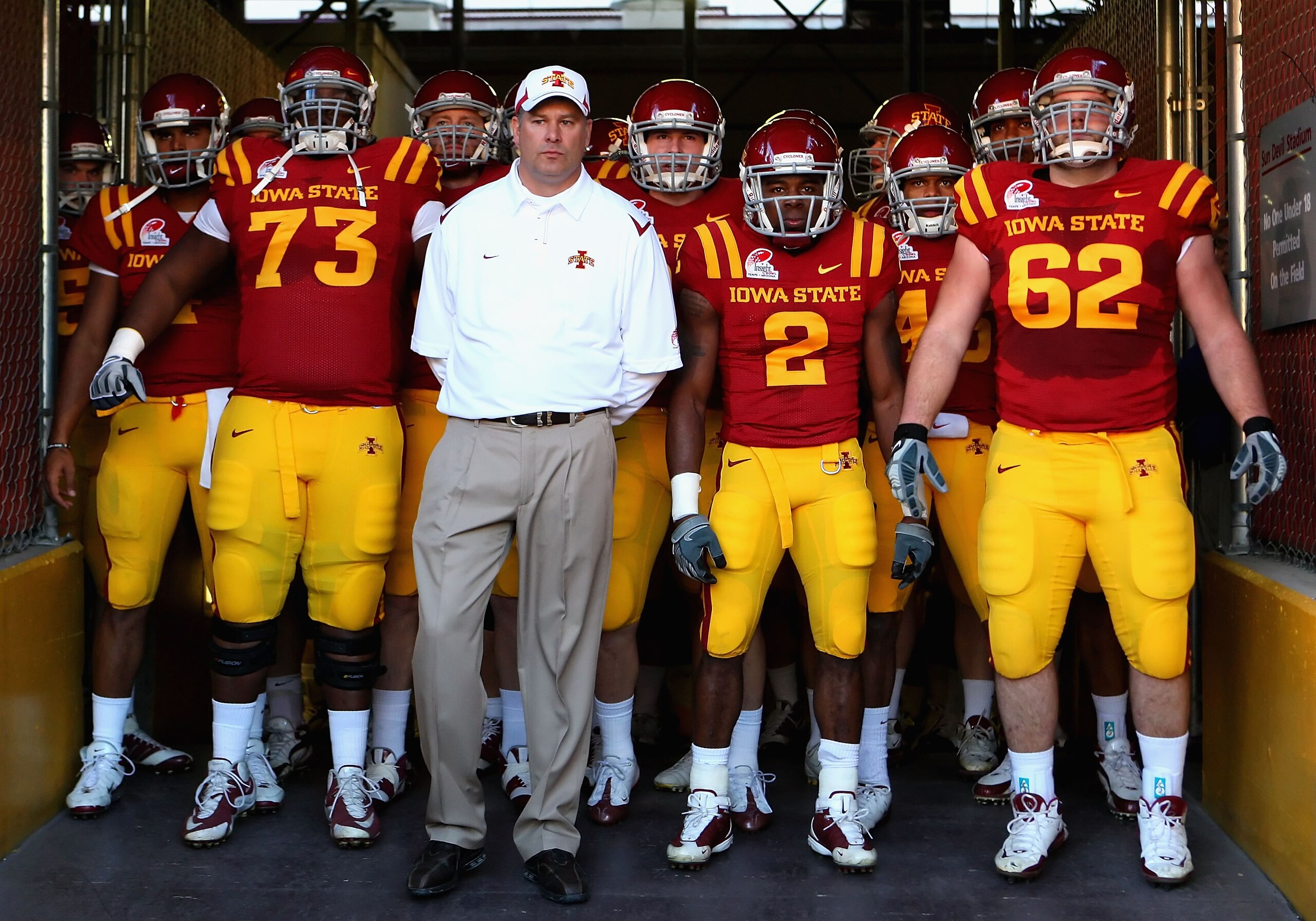 TEMPE, AZ - DECEMBER 31: (L-R) Reggie Stephens #73, head coach Paul Rhoads, Sedrick Johnson #2 and Nate Frere #62 of the Iowa State Cyclones stand with teammates as they prepare to take the field before the Insight Bowl against the Minnesota Golden Gophe TEMPE, AZ - DECEMBER 31: (L-R) Reggie Stephens #73, head coach Paul Rhoads, Sedrick Johnson #2 and Nate Frere #62 of the Iowa State Cyclones stand with teammates as they prepare to take the field before the Insight Bowl against the Minnesota Golden Gophe
