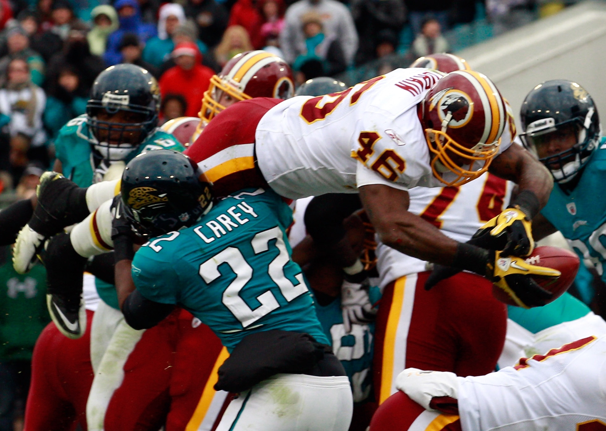 JACKSONVILLE, FL - DECEMBER 26:  Ryan Torain #46 of the Washington Redskins dives for a touchdown over Don Carey #22 of the Jacksonville Jaguars during the game at EverBank Field on December 26, 2010 in Jacksonville, Florida.  (Photo by Sam Greenwood/Gett