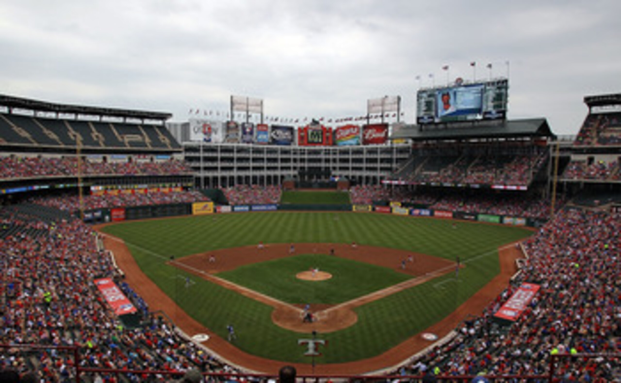 ARLINGTON, TX - APRIL 24:  Baseball fans watch a game between the Kansas City Royals and the Texas Rangers at Rangers Ballpark in Arlington on April 24, 2011 in Arlington, Texas.  (Photo by Ronald Martinez/Getty Images)