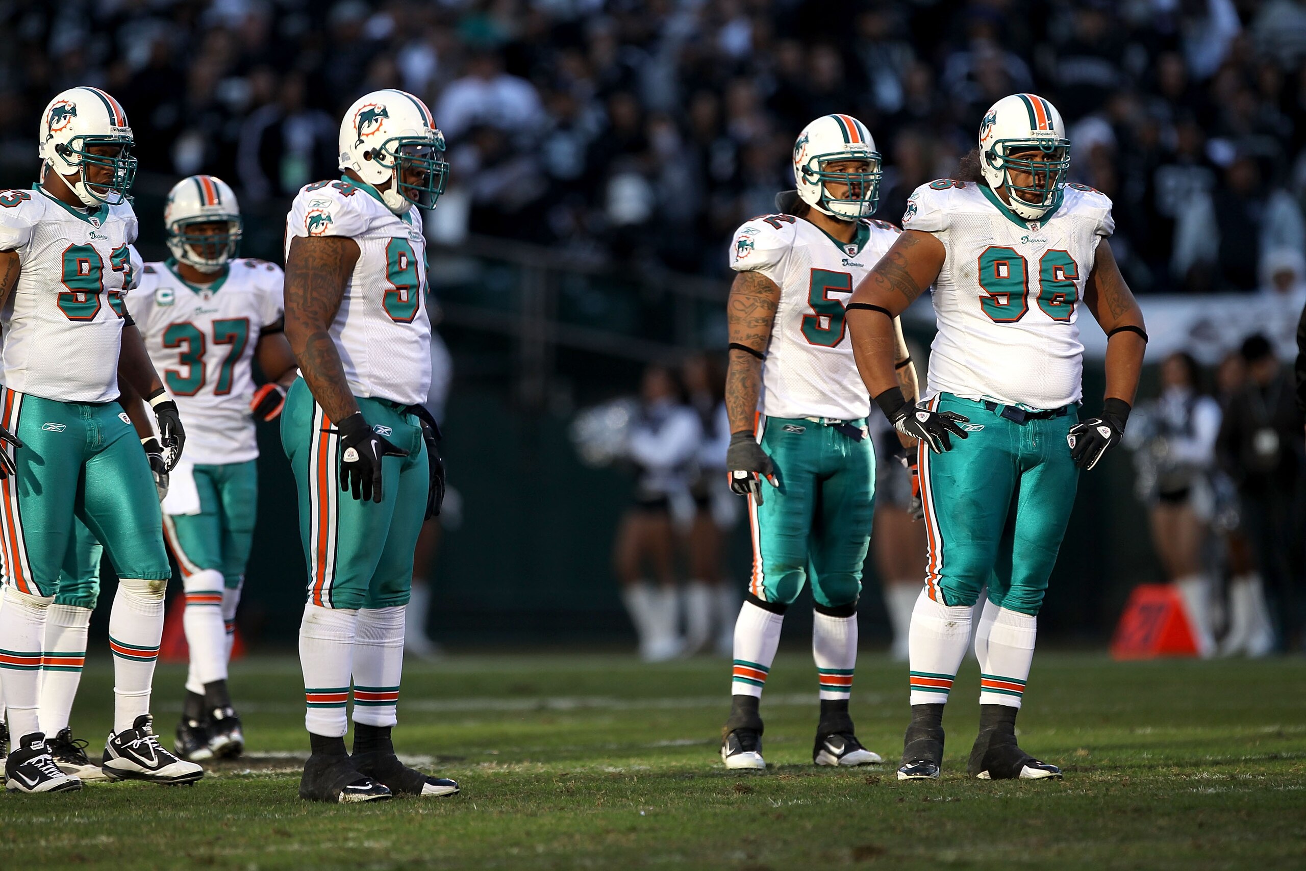 OAKLAND, CA - NOVEMBER 28: Yeremiah Bell #37, Quentin Moses #93, Randy Starks #94, Channing Crowder #52 and Paul Soliai #96 of the Miami Dolphins get ready for a play against the Oakland Raiders at Oakland-Alameda County Coliseum on November 28, 2010 in O